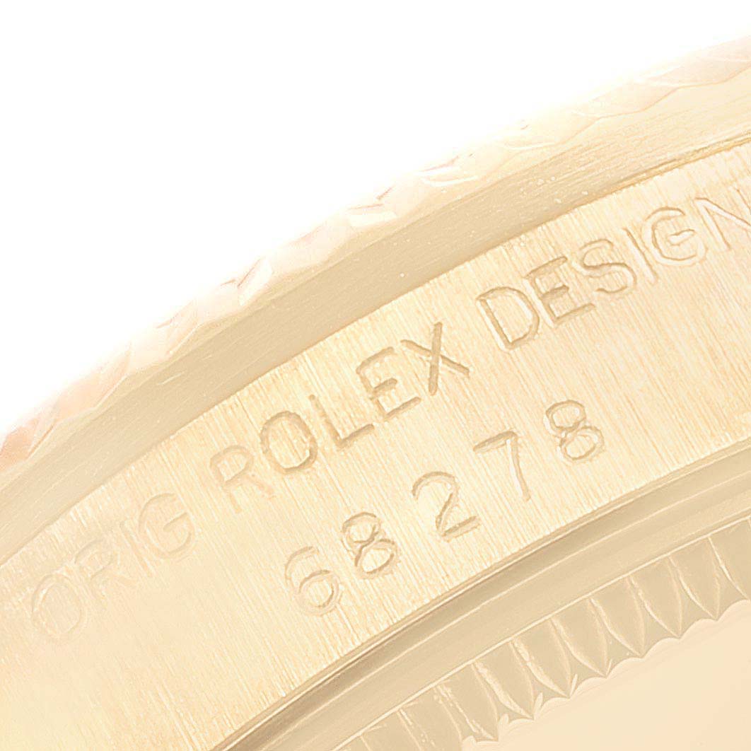 The image shows a close-up of the case
s side, including the bezel and engraving on the Rolex President 68278 Women
s Yellow Gold Champagne Dial 68278 Women
s Yellow Gold Champagne Dial model.