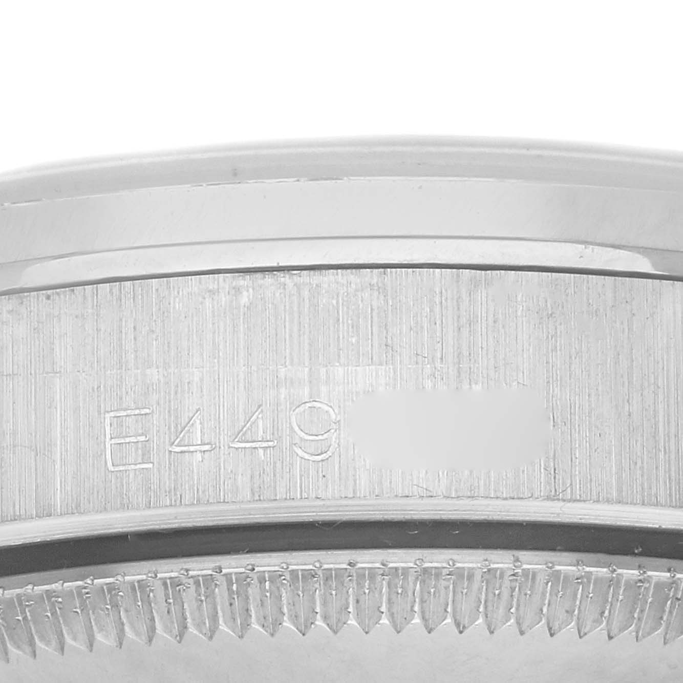 The image shows a close-up side view of the bezel and serial number engraving on a Rolex President 68159 Women
s White Gold Silver Dial 68159 Women
s White Gold Silver Dial watch.