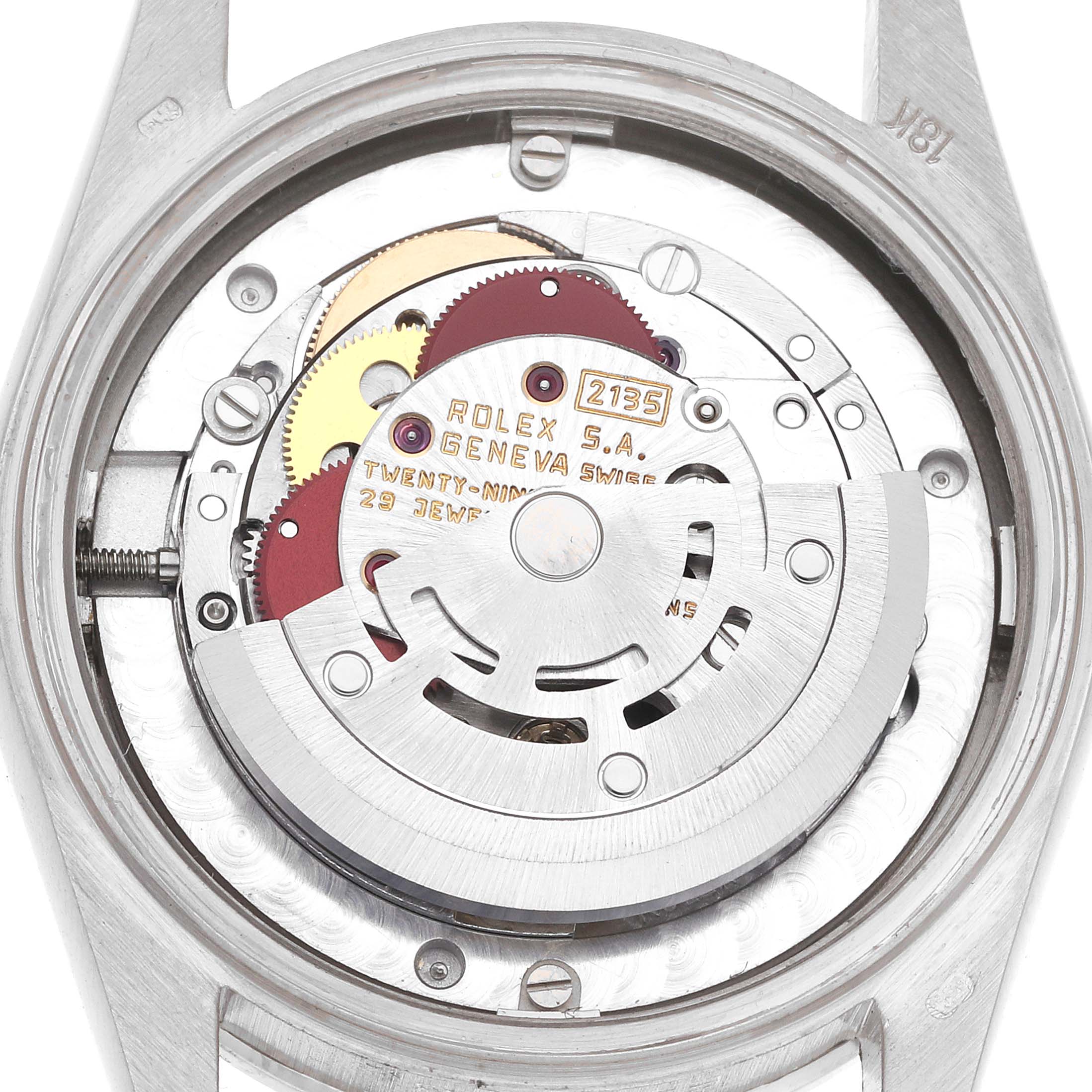 The image shows the internal movement of a Rolex President 68159 Women
s White Gold Silver Dial 68159 Women
s White Gold Silver Dial watch, displaying gears and the mechanism from the back angle.