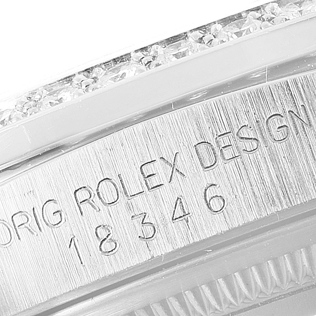 The close-up image of the Rolex President 18346 Men's Platinum Silver Dial 18346 Men's Platinum Silver Dial model shows part of the case back with engraved text and a diamond-studded bezel.