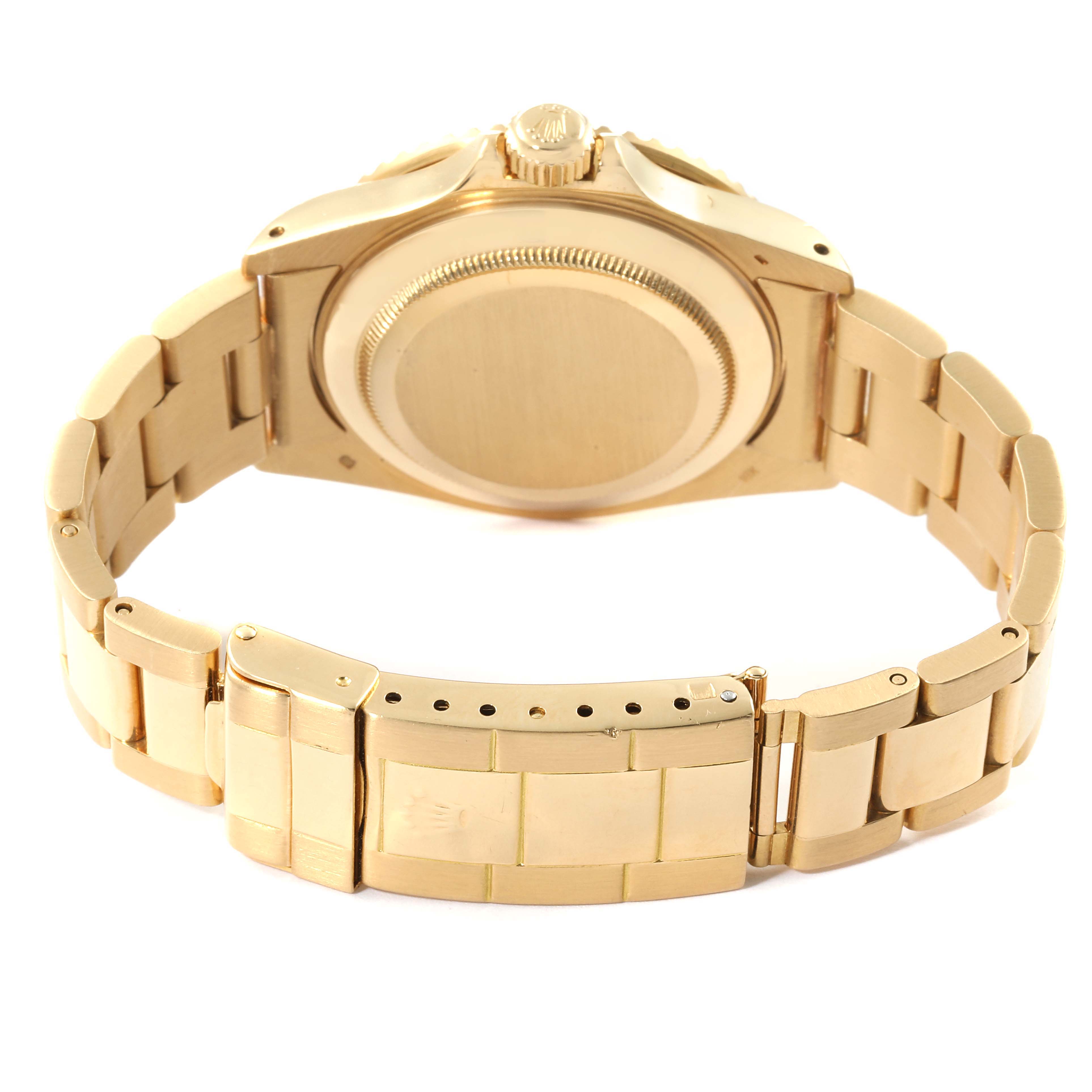 This image shows the back case and bracelet of a Rolex Submariner 16808 Men's Yellow Gold Black Dial 16808 Men's Yellow Gold Black Dial watch from a rear angle.
