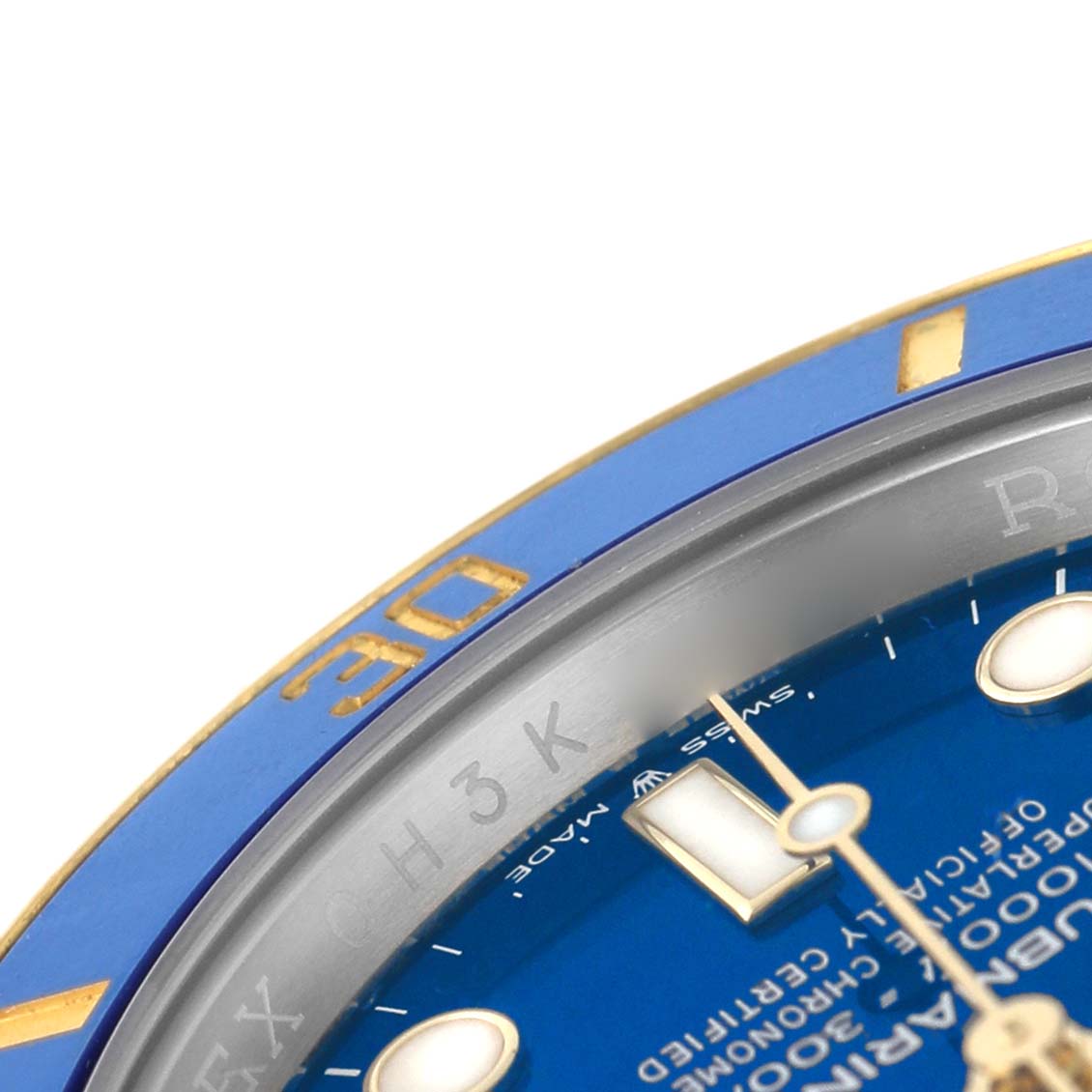 The image shows a close-up of the Rolex Submariner M126613LB-0002 Men's Stainless Steel Blue Dial's blue bezel, partial dial, and chapter ring at an angled perspective.