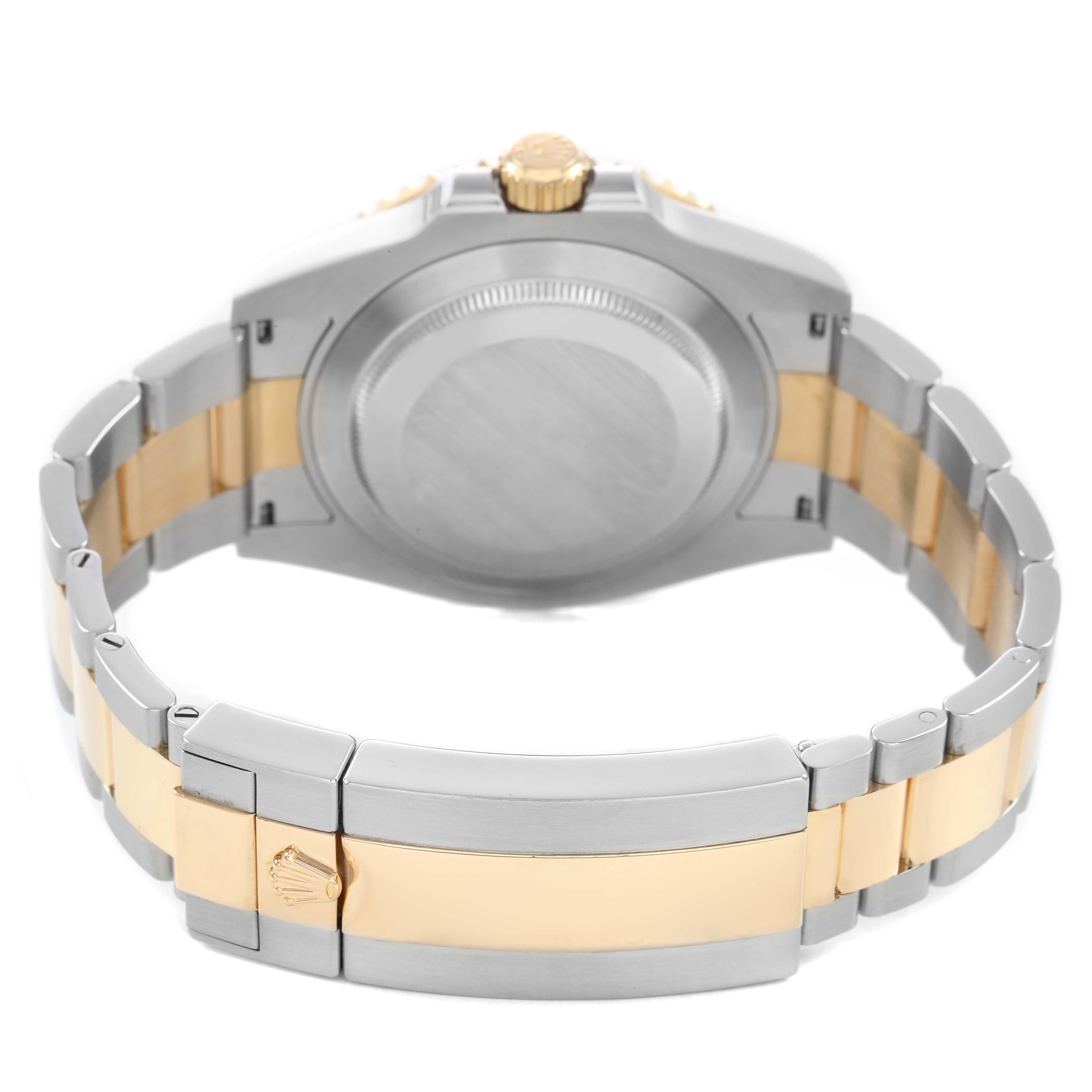 The image shows the back of a Rolex Submariner M126613LB-0002 Men's Stainless Steel Blue Dial, highlighting the closed clasp and bracelet with two-tone metal.