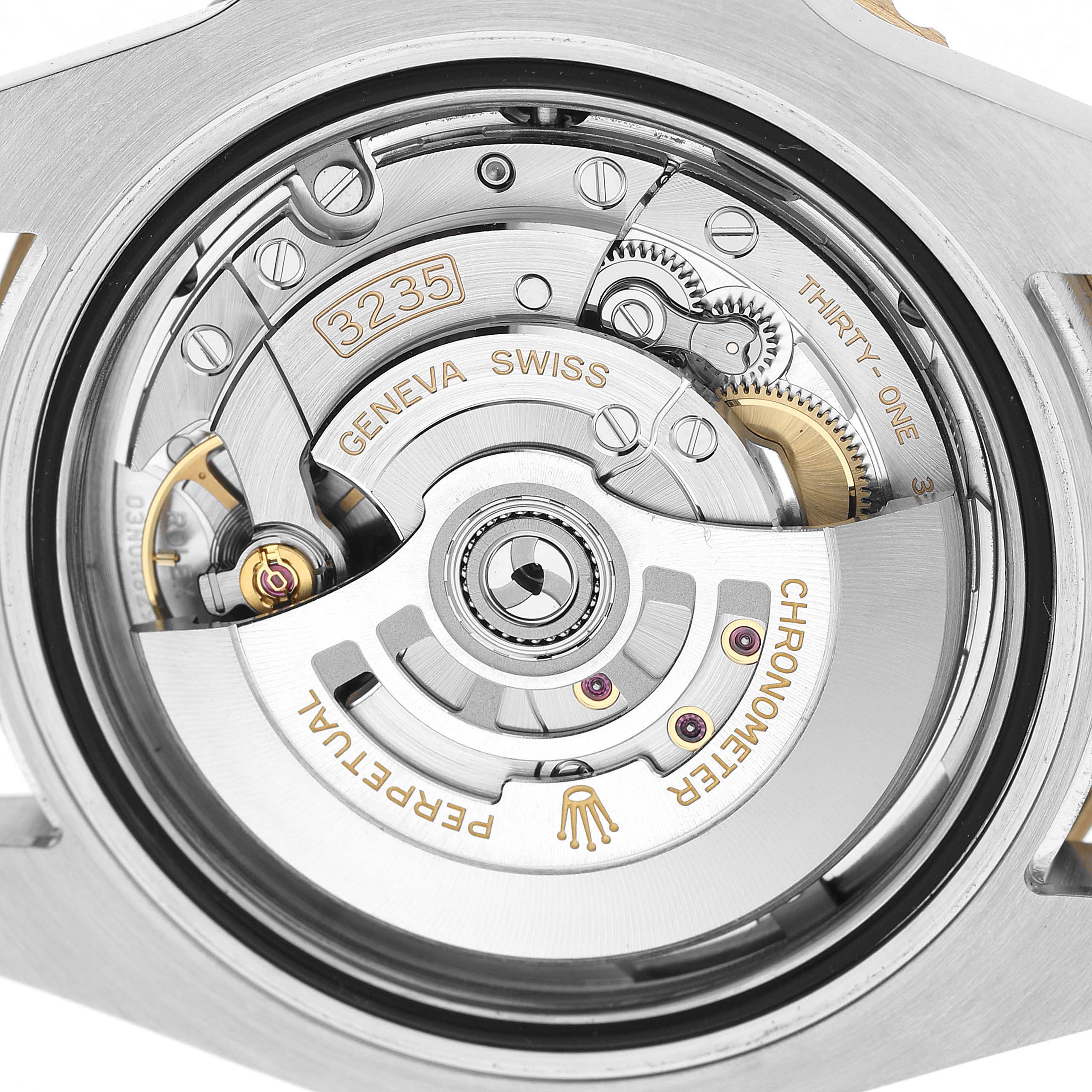 The image shows the movement of a Rolex Submariner 126613LB Men's Stainless Steel Blue Dial, highlighting gears and the rotor at a close-up angle.