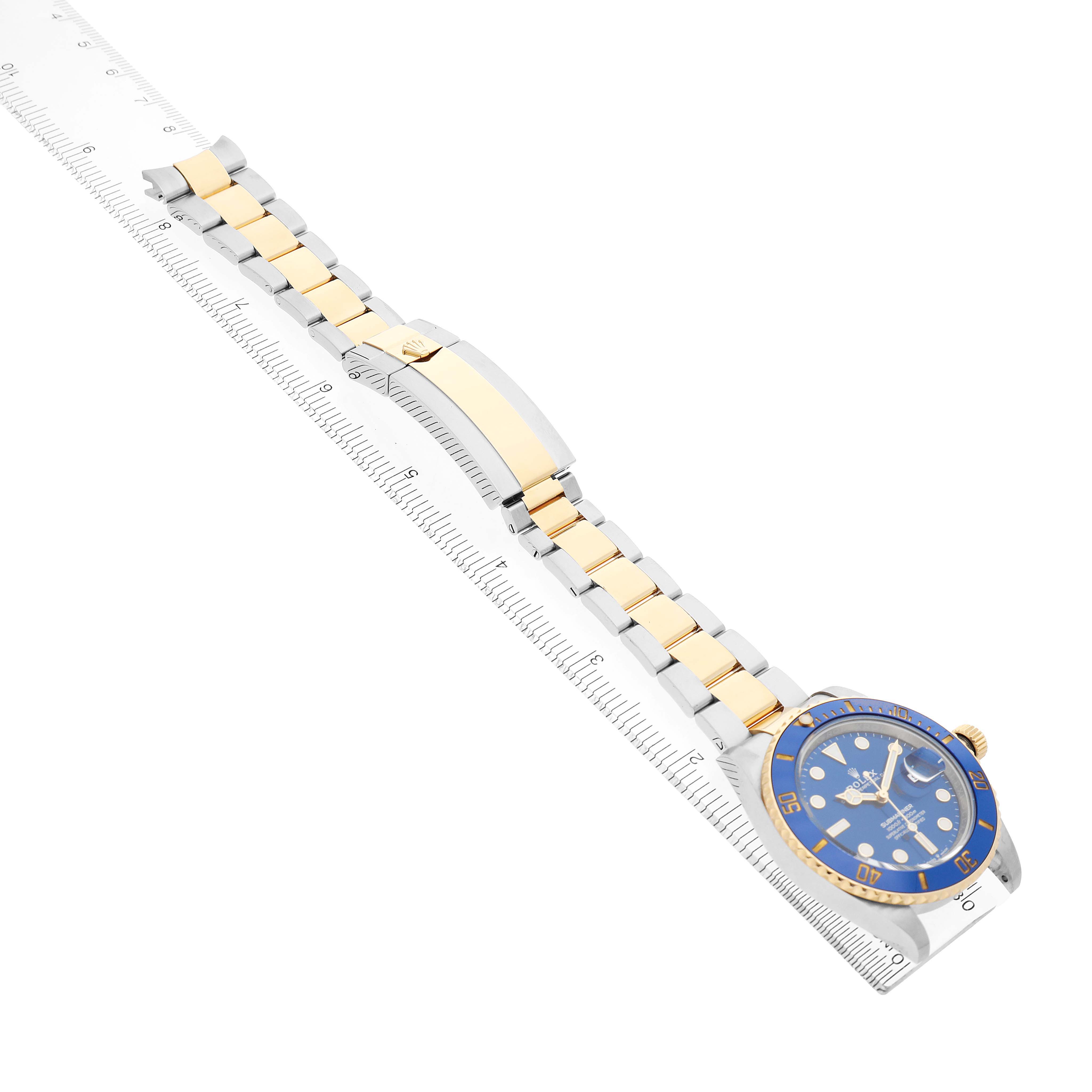 The Rolex Submariner 126613LB Men's Stainless Steel Blue Dial watch is shown at a diagonal angle, highlighting its bracelet, clasp, and blue watch face.
