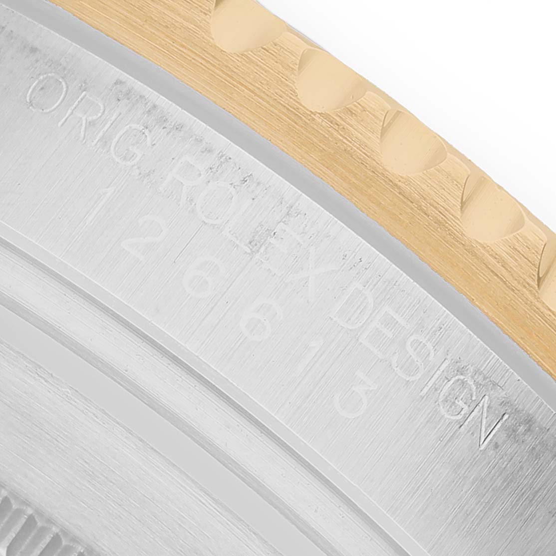 The image shows a close-up of the edge and engraved markings on the bezel of a Rolex Submariner 126613LB Men's Stainless Steel Blue Dial watch.