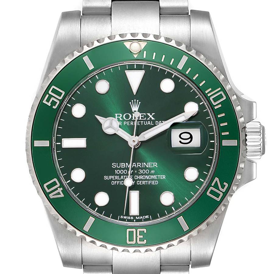 The Rolex Submariner watch is shown from a top-down angle, highlighting the green dial, bezel, and date window.