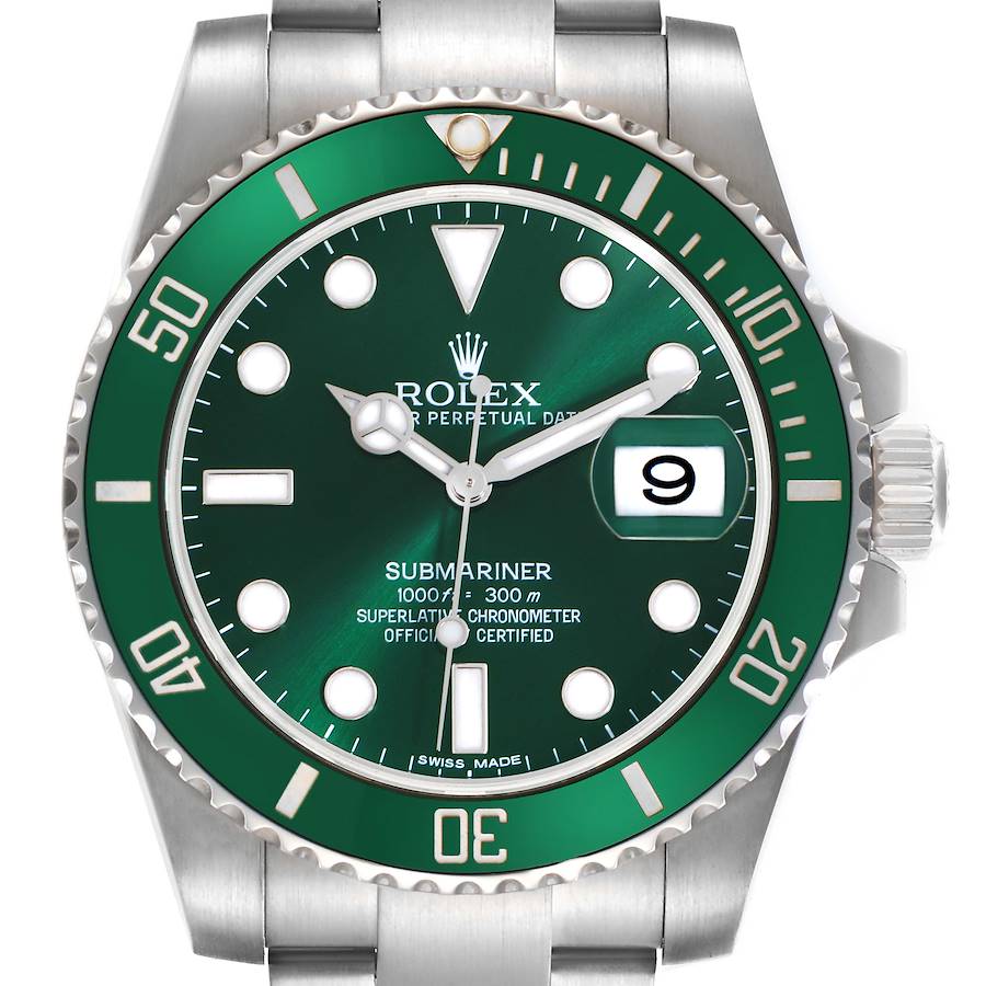 The Rolex Submariner watch is shown from the front, highlighting the green bezel, dial, and date function.