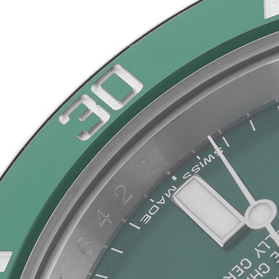 The image shows a close-up of the bezel and partial dial of a Rolex Submariner 116610LV Men
s Stainless Steel Green Dial 116610LV Men
s Stainless Steel Green Dial, focusing on the 30 marker and details on the face.