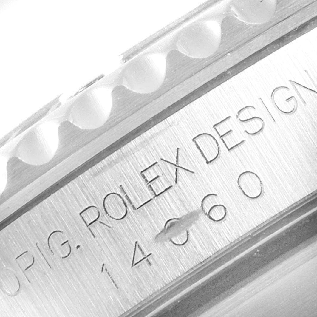 This image shows the engraved side of the case of a Rolex Submariner 14060 Men
s Stainless Steel Black Dial 14060 Men
s Stainless Steel Black Dial watch.