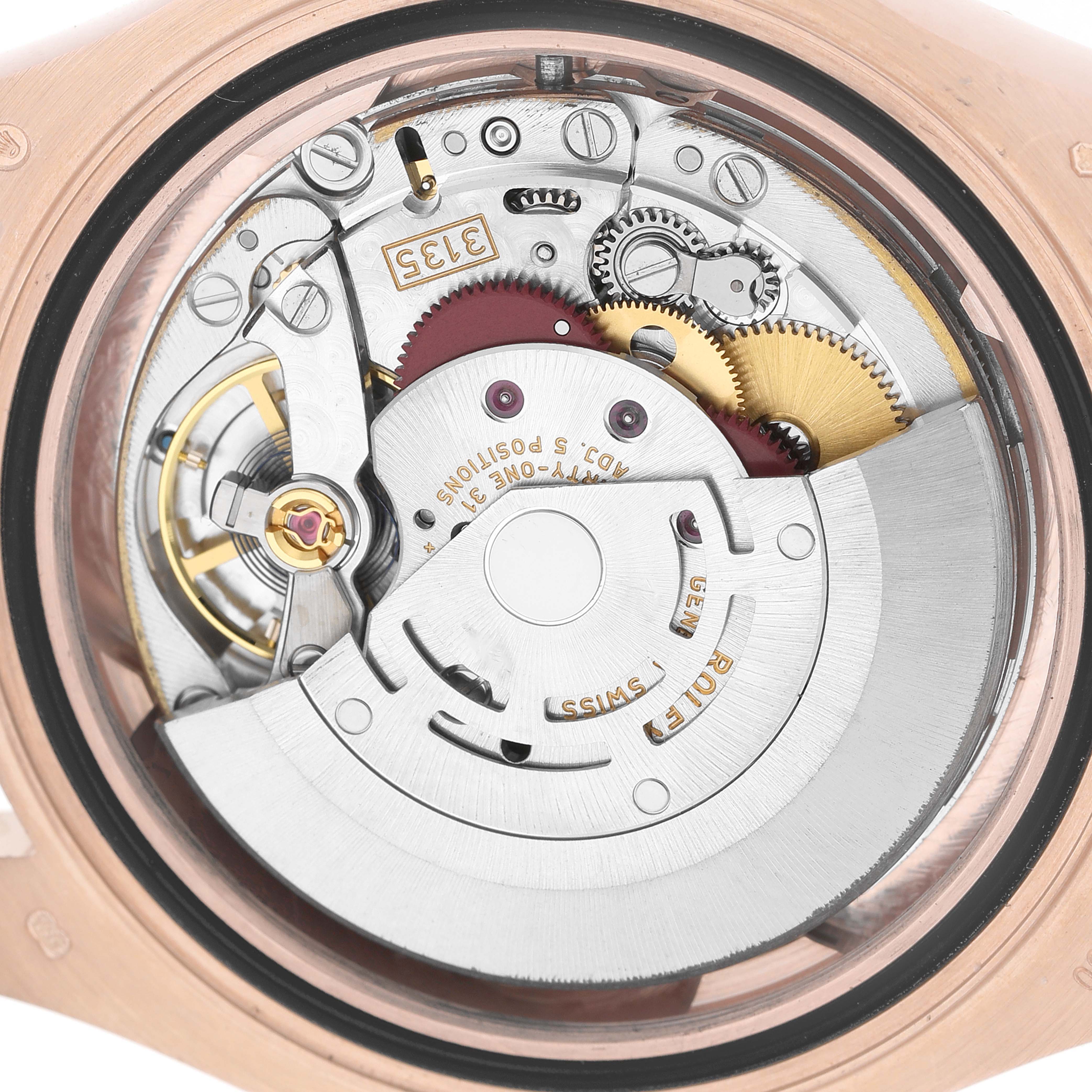 The image shows the back view of a Rolex Yacht-Master 116655 Men's Rose Gold Black Dial, highlighting its intricate movement and components.
