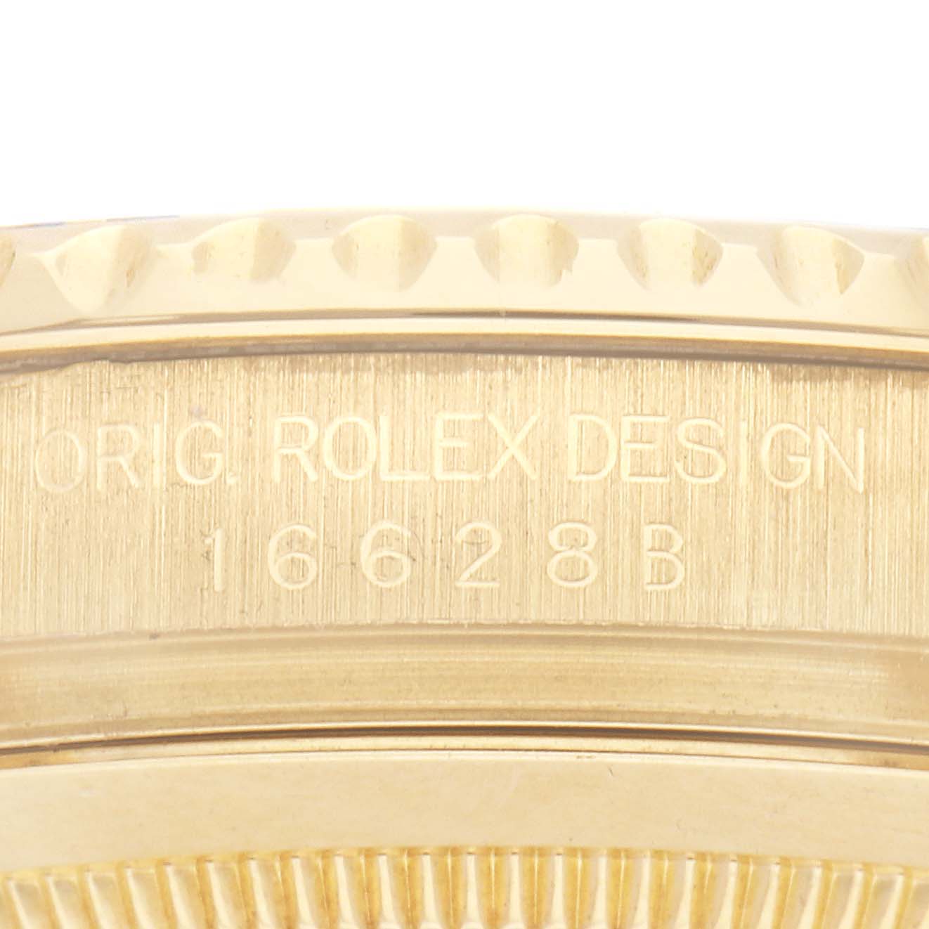 The image shows the side of a Rolex Yacht-Master 16628 Men
s Yellow Gold Blue Dial 16628 Men
s Yellow Gold Blue Dial watch, highlighting the engraved model number and design details.
