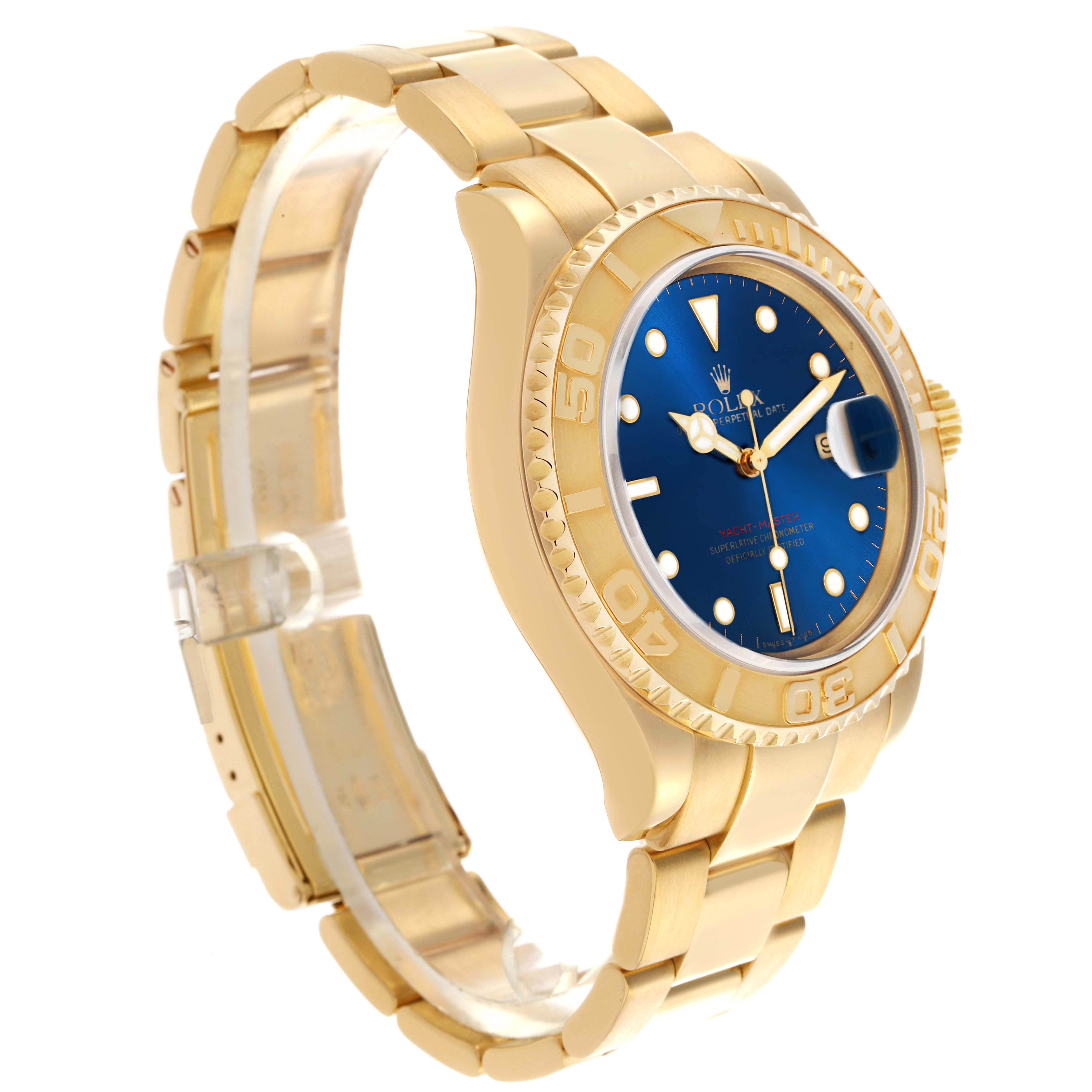 The Rolex Yacht-Master 16628 Men
s Yellow Gold Blue Dial watch is shown at a slight angled side view, highlighting the gold bracelet, blue dial, and bezel.