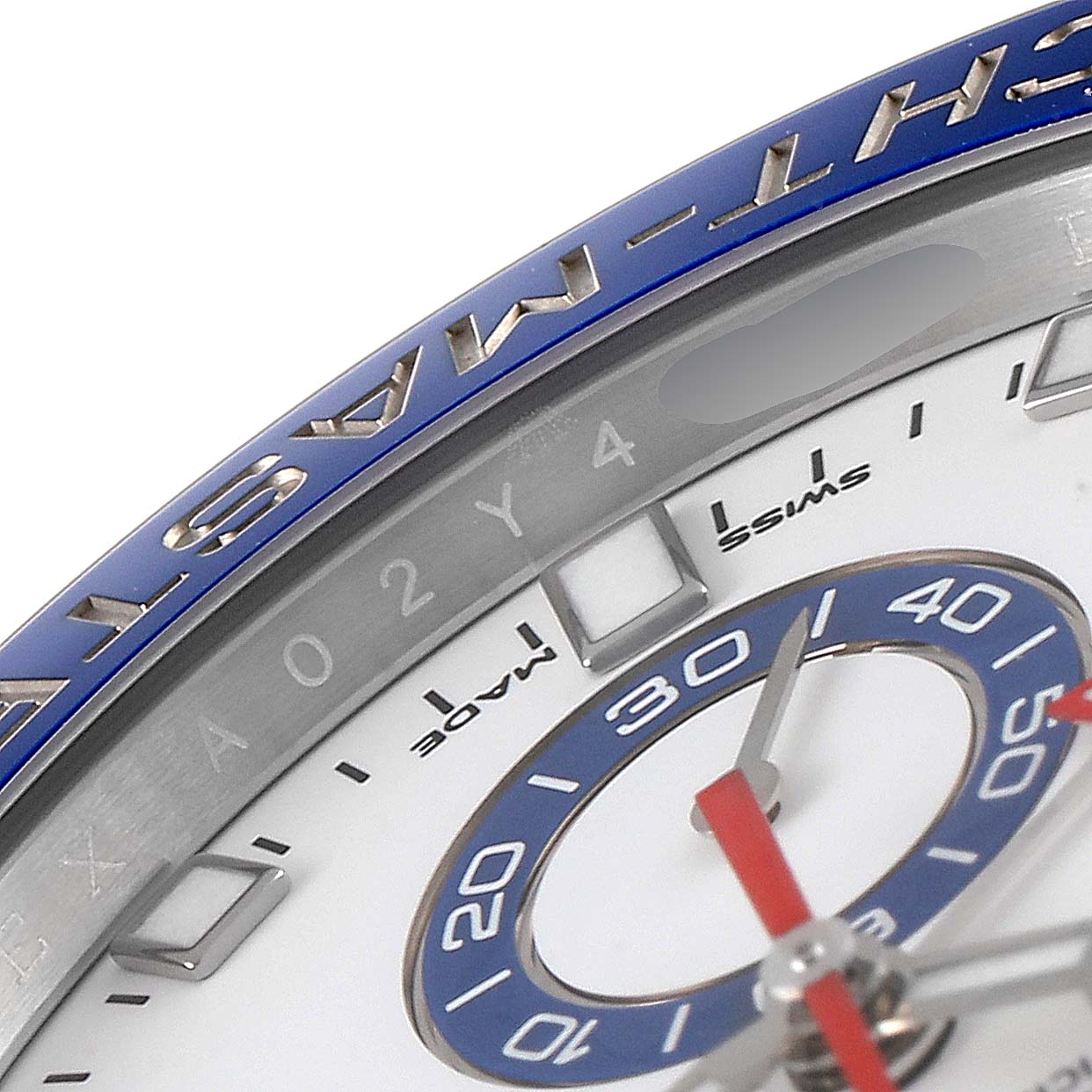 This close-up of the Rolex Yacht-Master 116680 Men
s Stainless Steel White Dial 116680 Men
s Stainless Steel White Dial watch shows part of the dial, bezel, and hands.