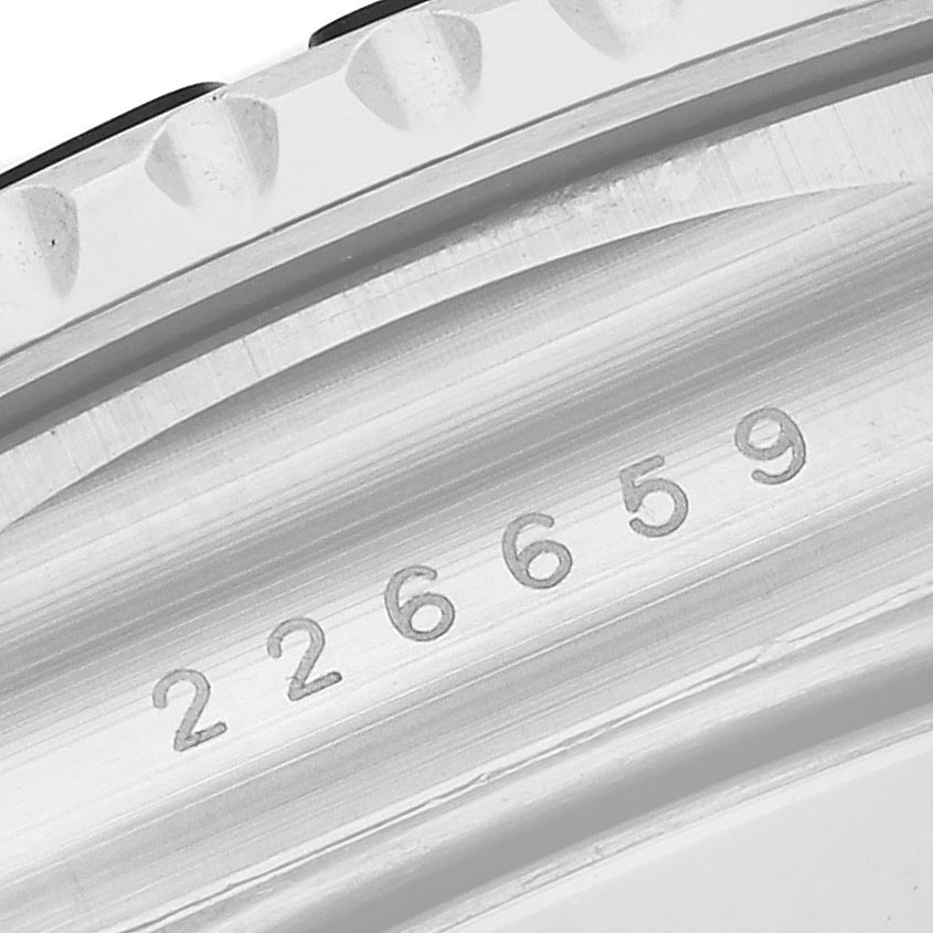 The image shows a close-up of the side of a Rolex Yacht-Master 226659 Men
s White Gold Black Dial 226659 Men
s White Gold Black Dial watch, focusing on the bezel and engraved serial number.