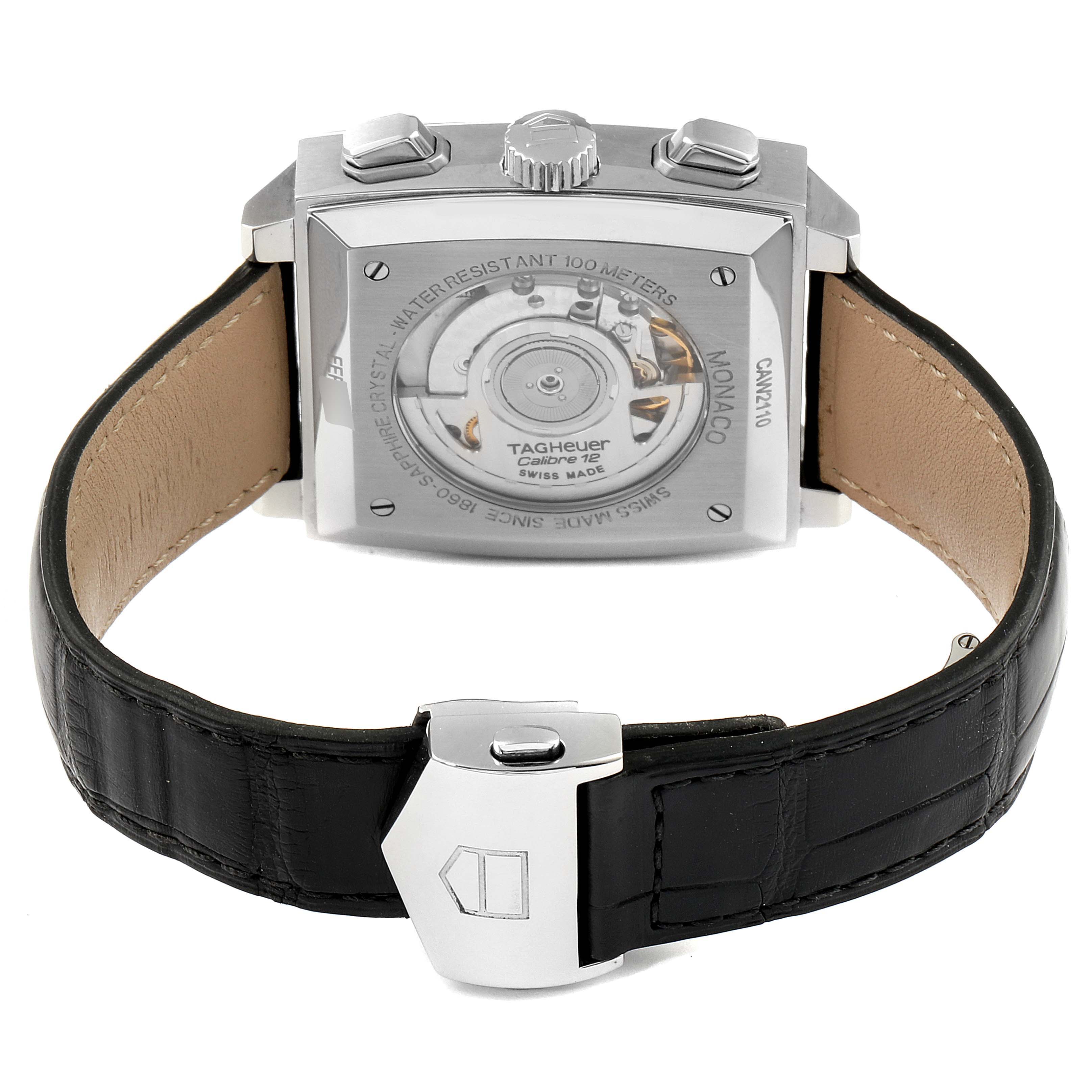 The image shows the back view of a Tag Heuer Monaco CAW2110.FC6177 Men's Stainless Steel Black Dial CAW2110.FC6177 Men's Stainless Steel Black Dial watch, highlighting its movement and leather strap.