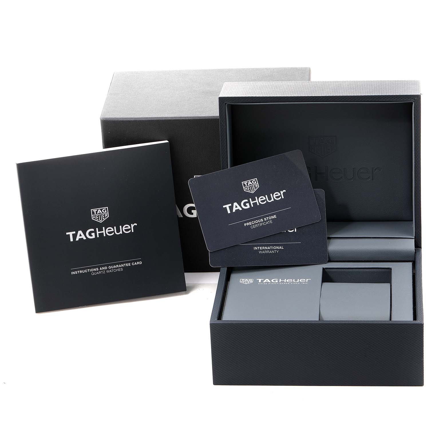 The image shows the packaging, warranty card, and instruction manual for the Tag Heuer Monaco WAW131E.FC6420 Men's Stainless Steel Brown Dial WAW131E.FC6420 Men's Stainless Steel Brown Dial watch.