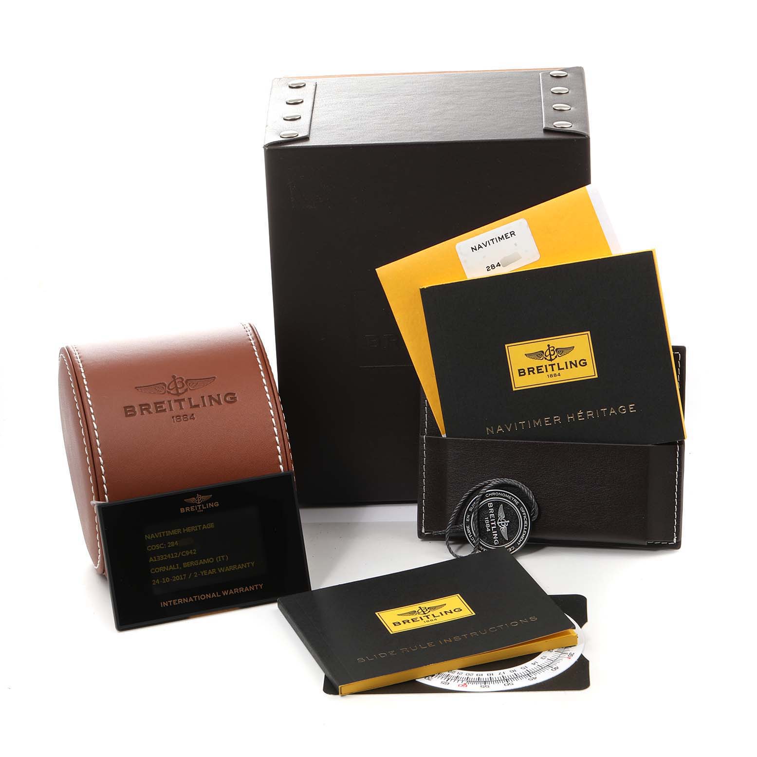 The image shows a Breitling Navitimer A13324 Men
s Stainless Steel Blue Dial A13324 Men
s Stainless Steel Blue Dial watch package, including the box, leather case, manuals, warranty card, and additional accessories.