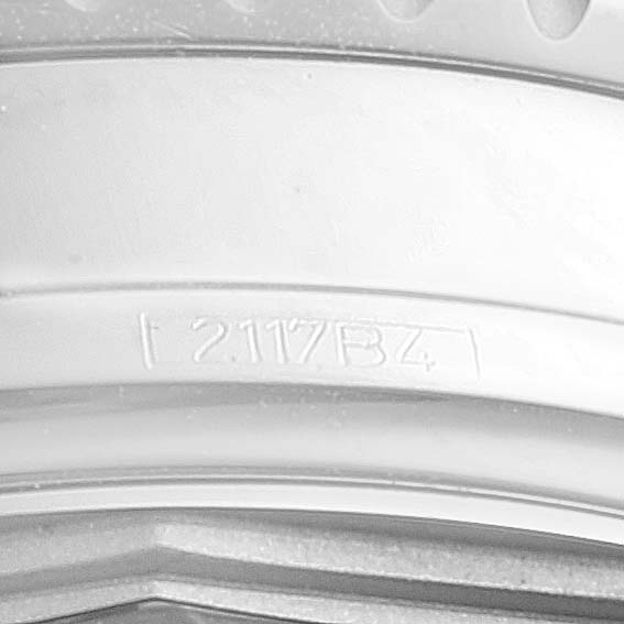 The image shows a close-up of the casing edge of a Breitling Navitimer A13324 Men
s Stainless Steel Blue Dial A13324 Men
s Stainless Steel Blue Dial watch.