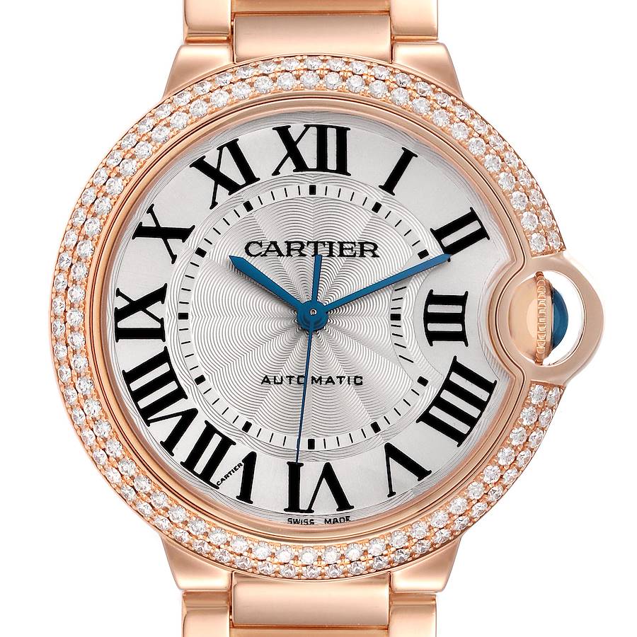 The Cartier Ballon Bleu watch is shown from the front, highlighting its round face, Roman numerals, and diamond-set bezel.