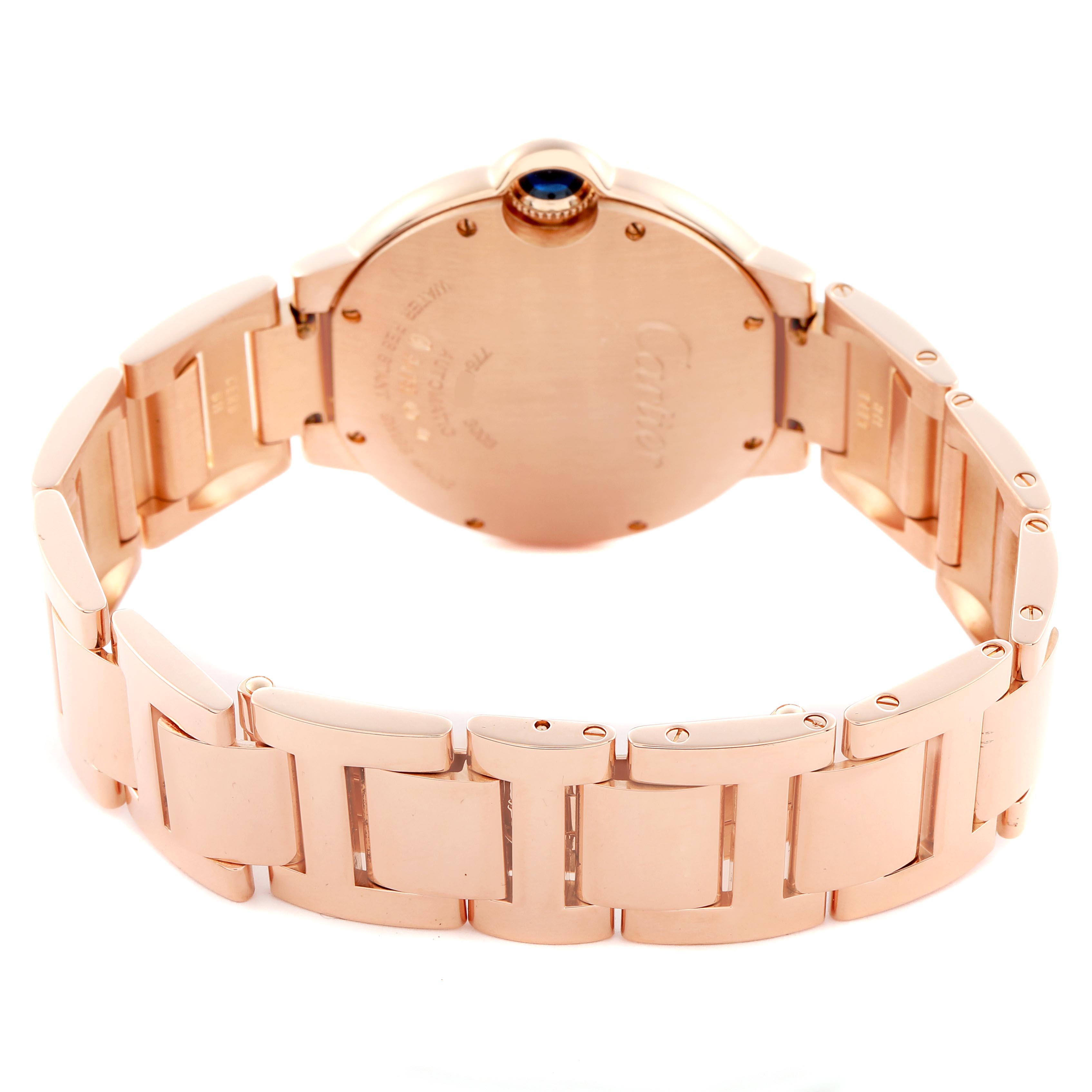 The image shows the back of the Ballon Bleu by Cartier, highlighting the case back and bracelet from a rear angle.