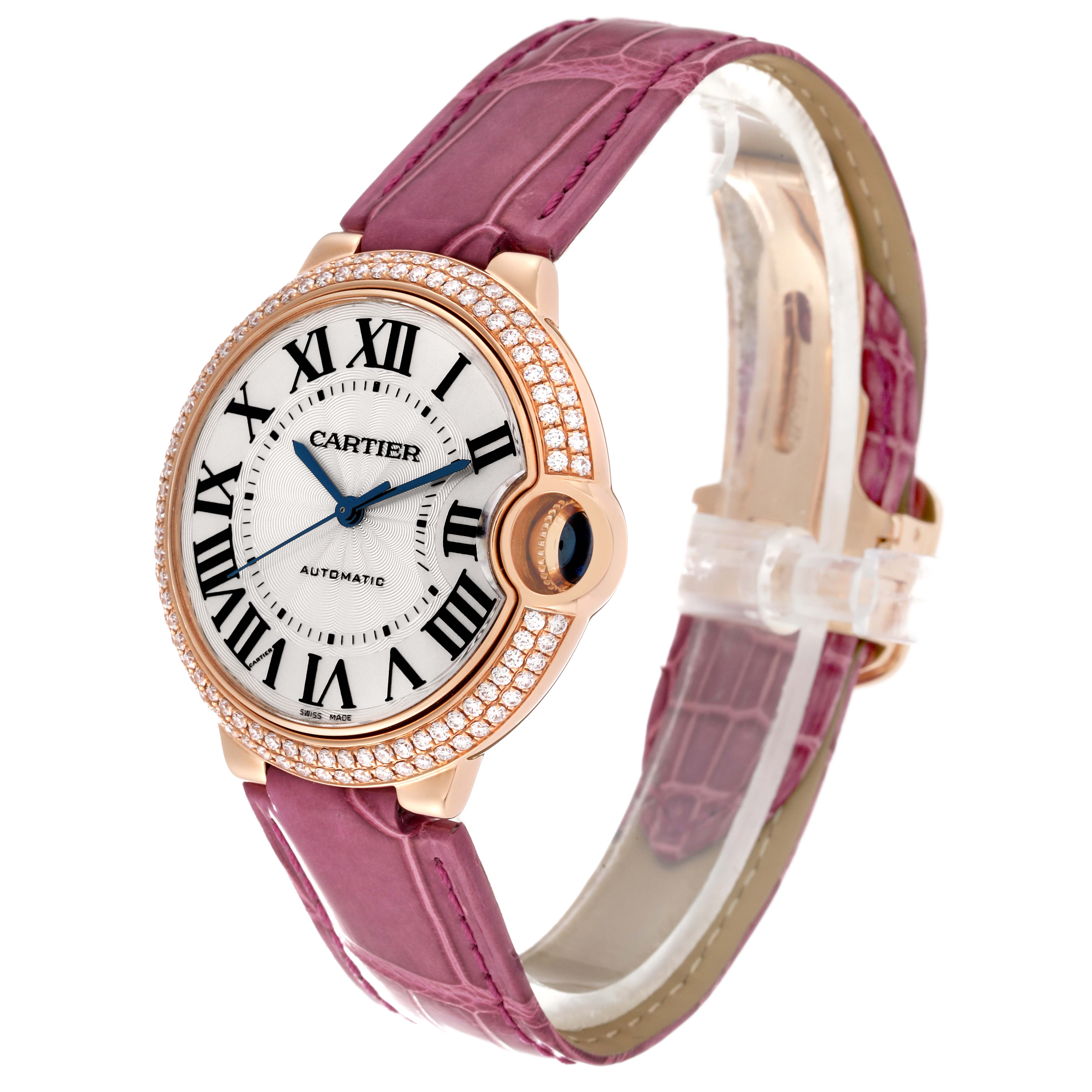 This image shows a side-front angle of a Cartier Ballon Bleu WE900551 Women's Rose Gold Silver Dial WE900551 Women's Rose Gold Silver Dial watch, featuring a pink strap and a diamond-encrusted bezel.