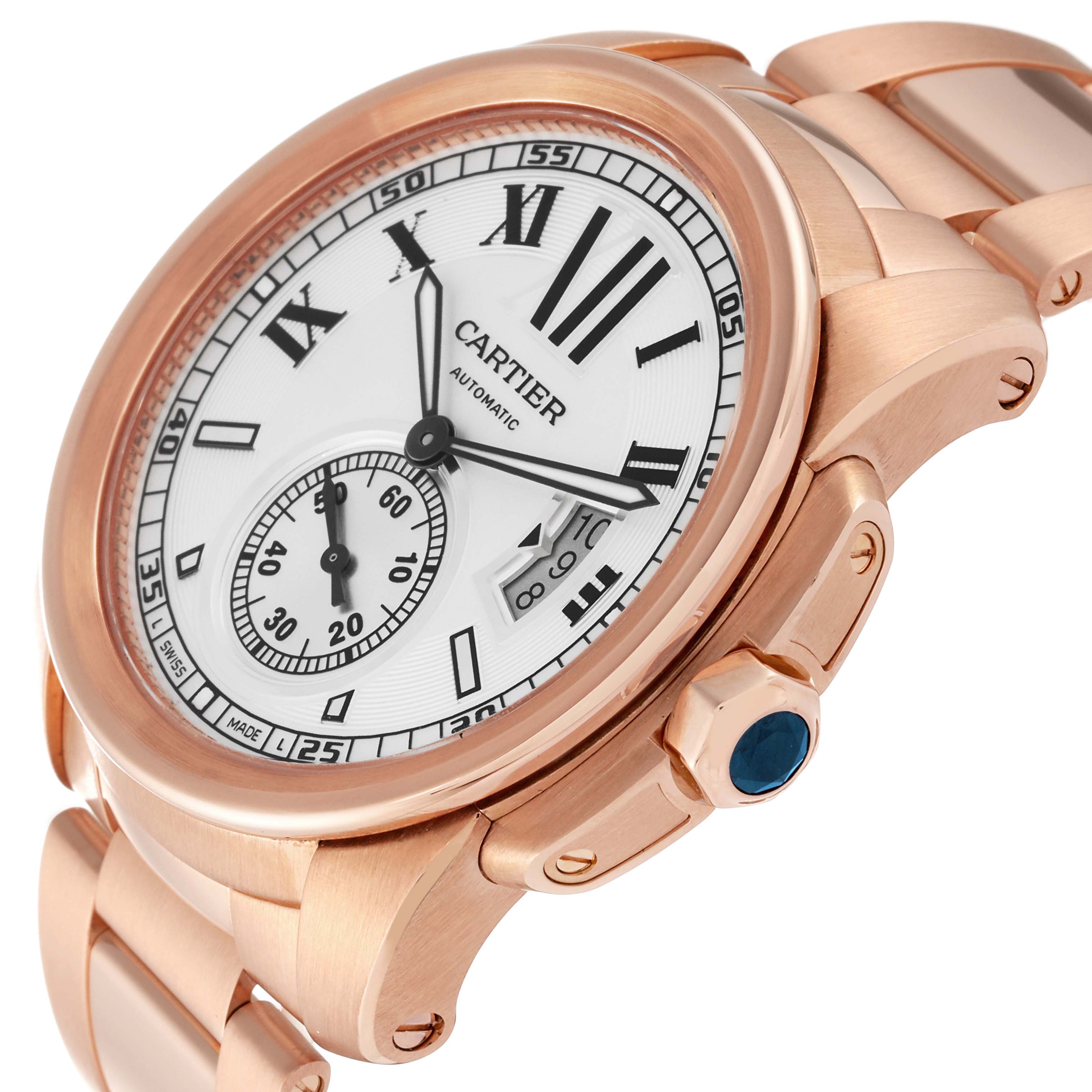 The image shows a close-up, angled view of a Calibre de Cartier watch by Cartier, highlighting the face, dial, and part of the bracelet.