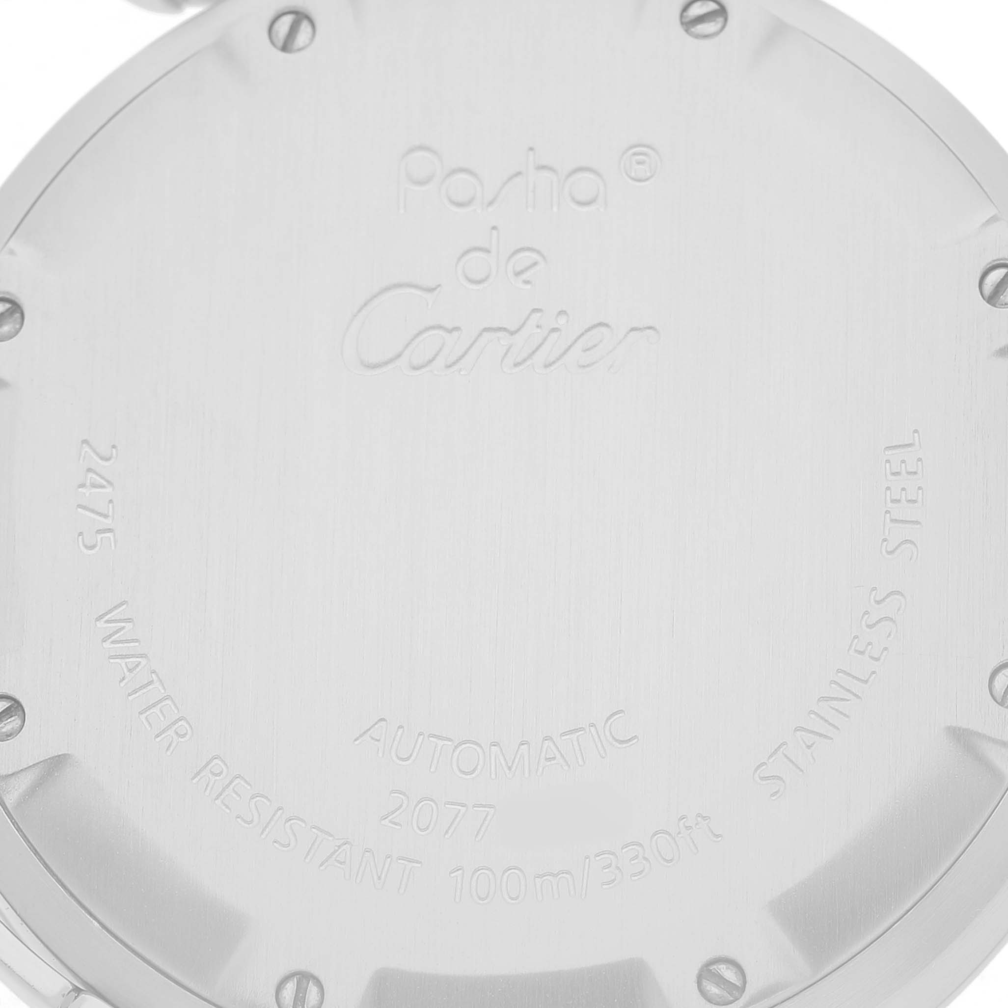 The image shows the back case of a Cartier Pasha W31055M7 Men's Stainless Steel White Dial watch, displaying engravings and screws.