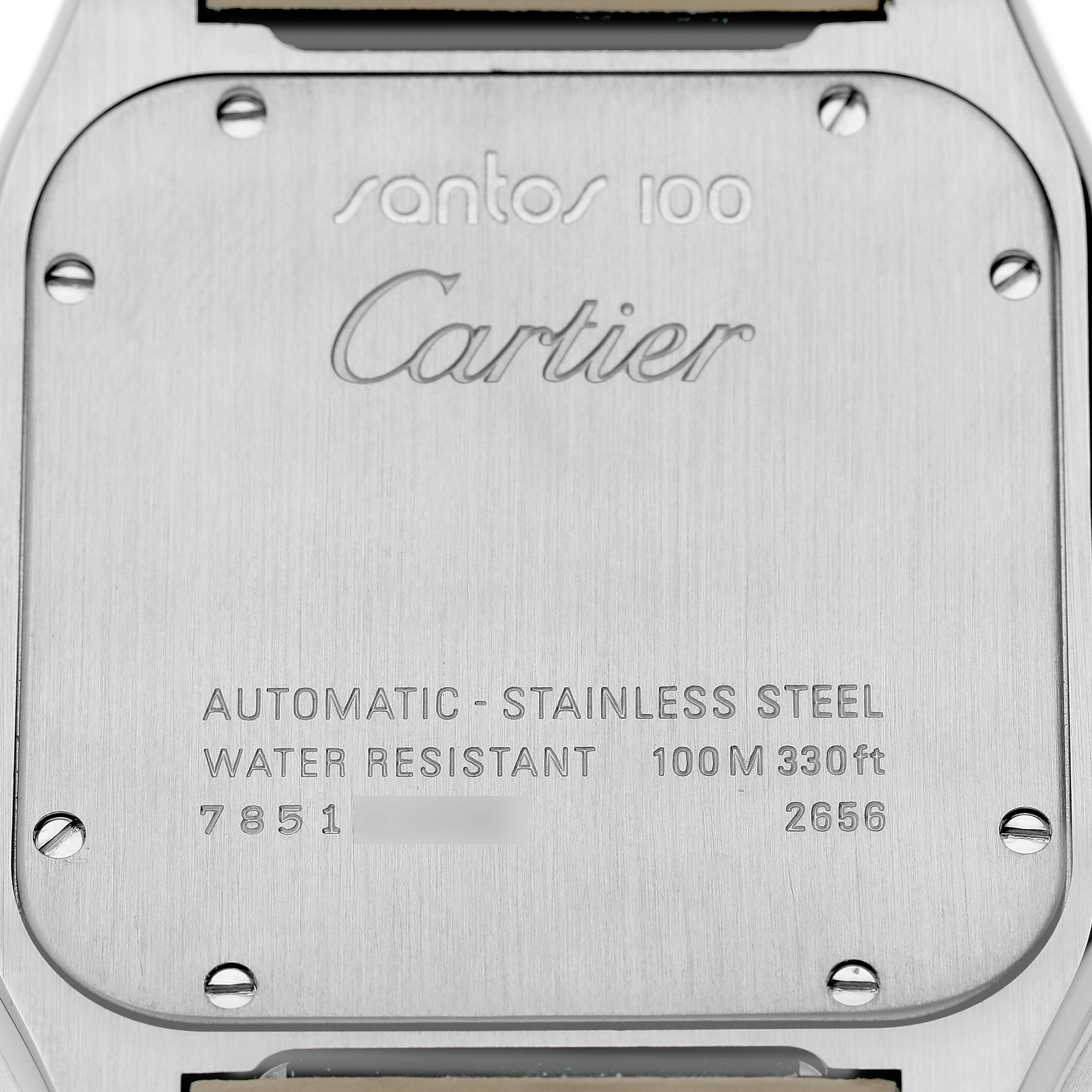 The image shows the back case of the Cartier Santos W20073X8 Men's Stainless Steel Silver Dial 100 watch, including engraved details and screws.