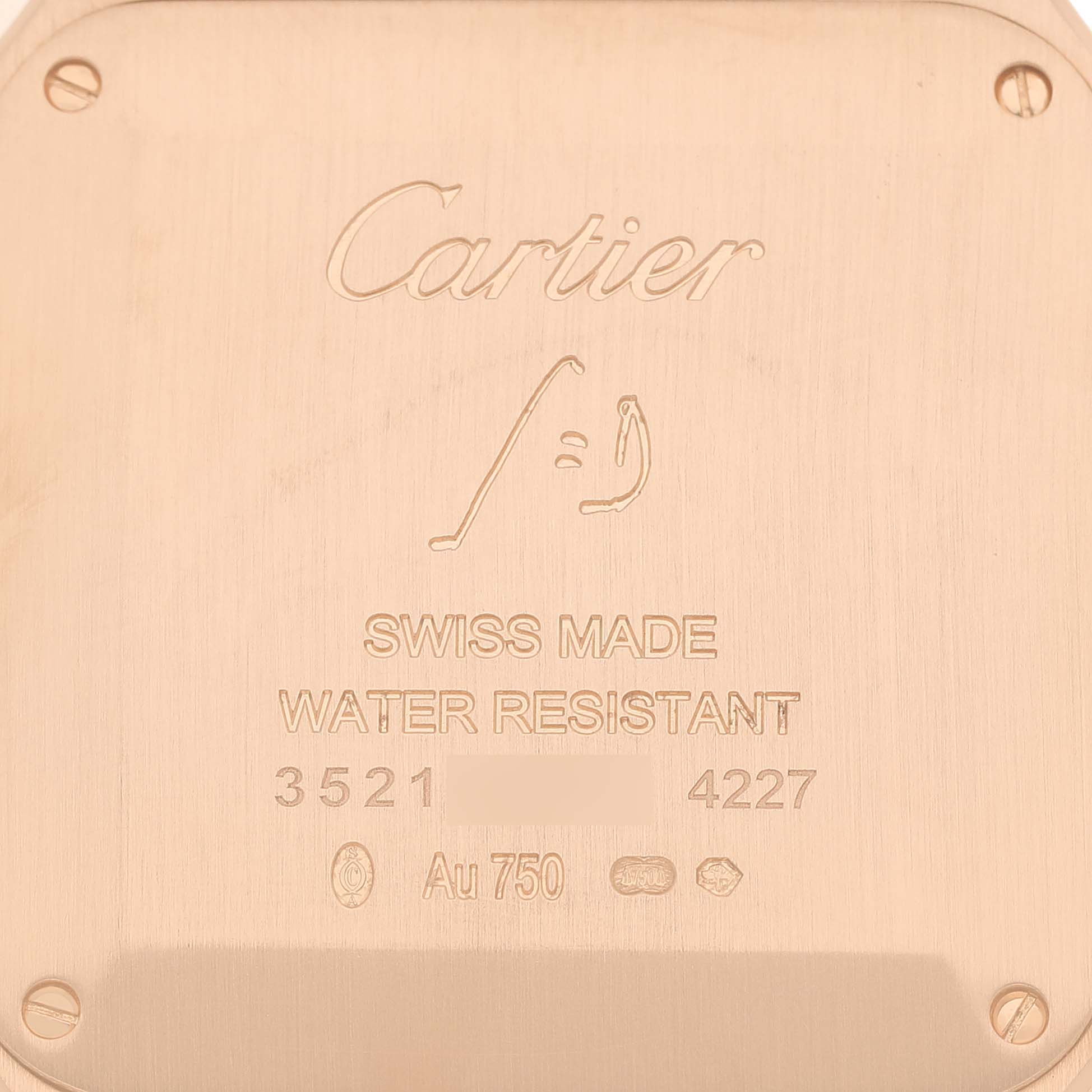 The image shows the case back of a Cartier Santos Dumont WGSA0021 Men's Rose Gold Silver Dial, displaying engravings for branding, "Swiss Made," and "Water Resistant."