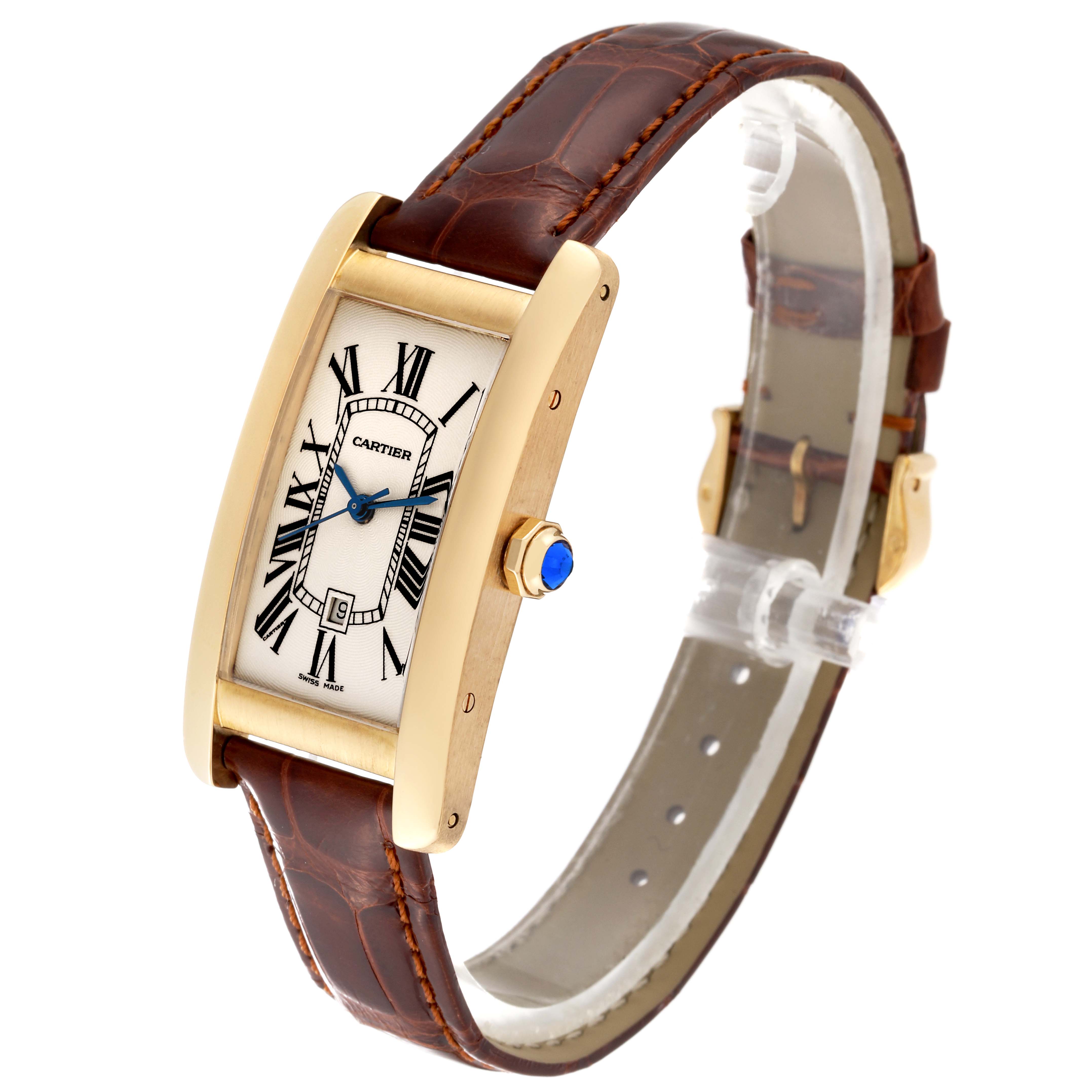 The Tank Americaine by Cartier is shown at an oblique angle, revealing its face, crown, and leather strap.