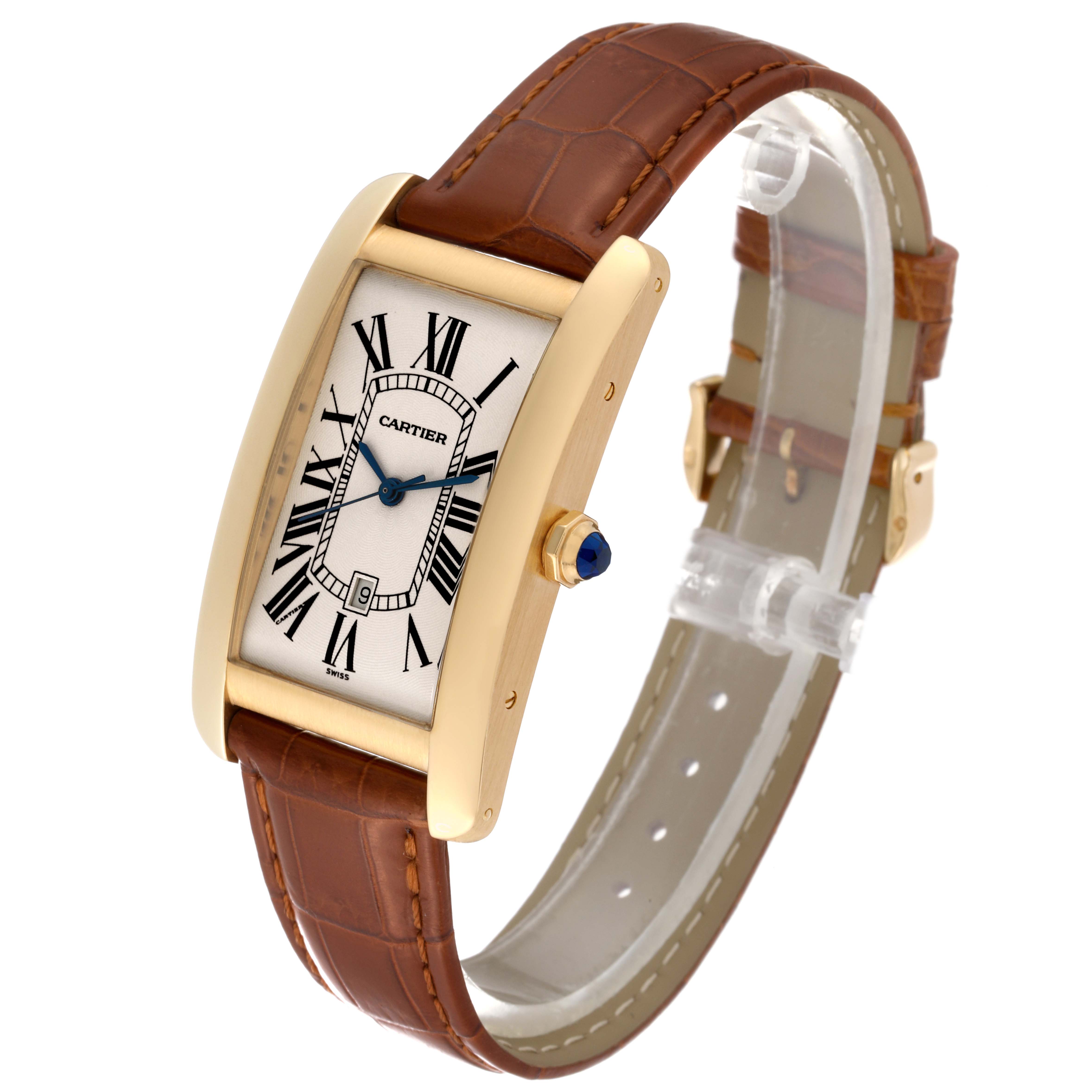 This image shows a Cartier Tank Americaine W2603156 Men's Yellow Gold Silver Dial W2603156 Men's Yellow Gold Silver Dial watch at a three-quarter angle, displaying the dial, crown, and brown leather strap.