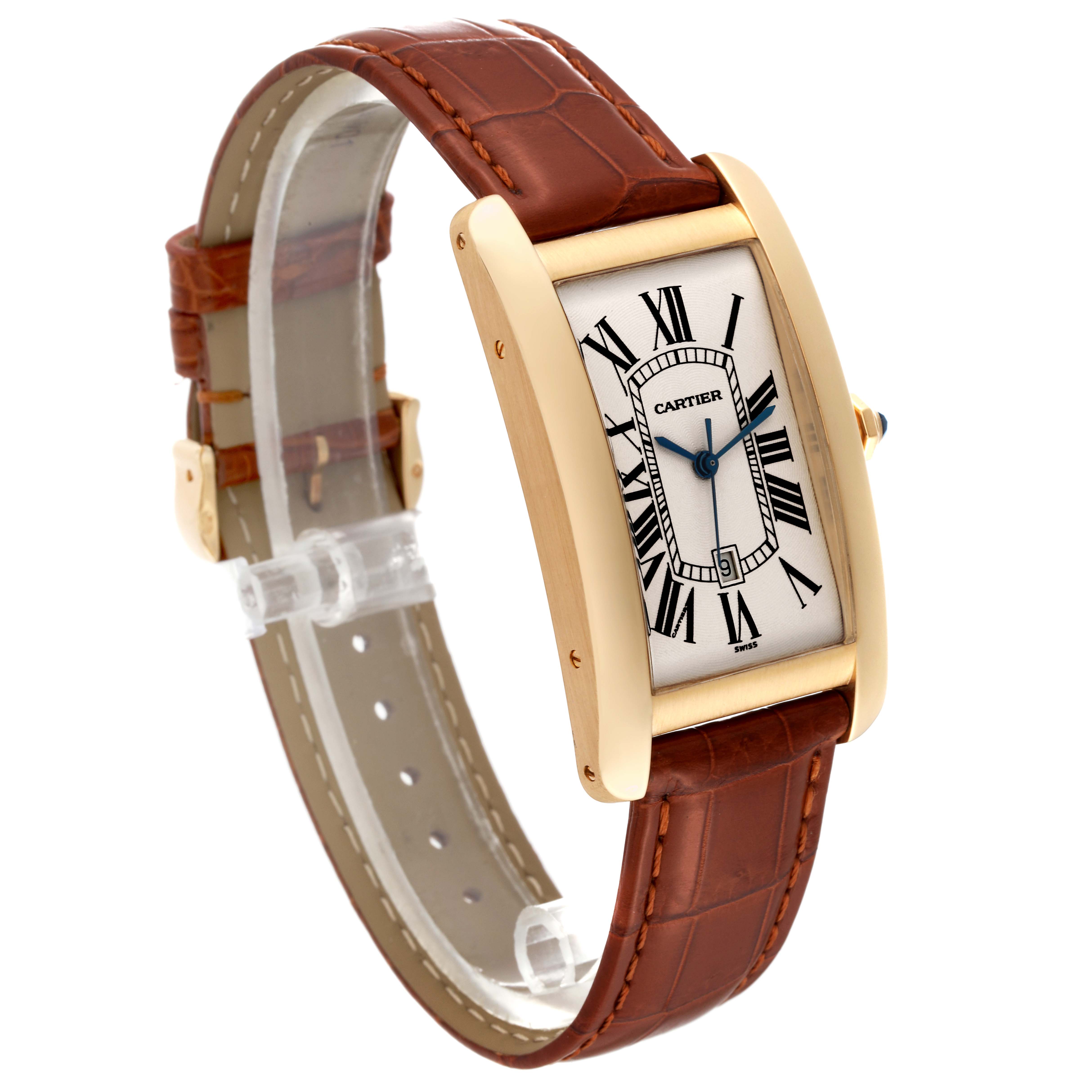 This image shows a Cartier Tank Americaine W2603156 Men's Yellow Gold Silver Dial W2603156 Men's Yellow Gold Silver Dial watch from a three-quarter angle, highlighting its rectangular face and brown leather strap.