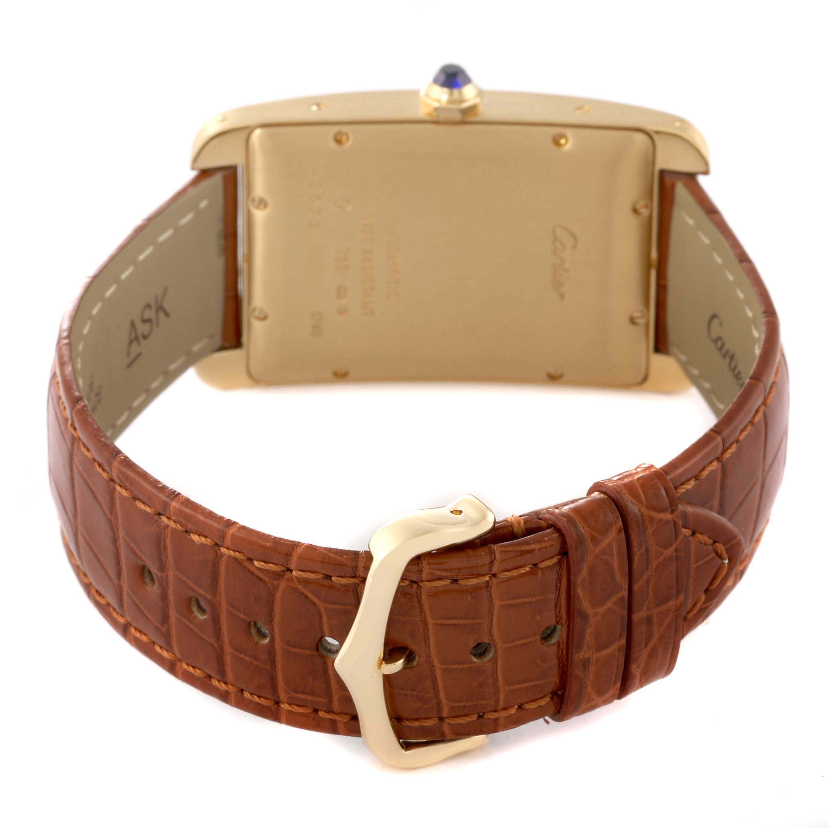 This image shows the back view of the Cartier Tank Americaine W2603156 Men's Yellow Gold Silver Dial W2603156 Men's Yellow Gold Silver Dial watch, focusing on the caseback, strap, and buckle.