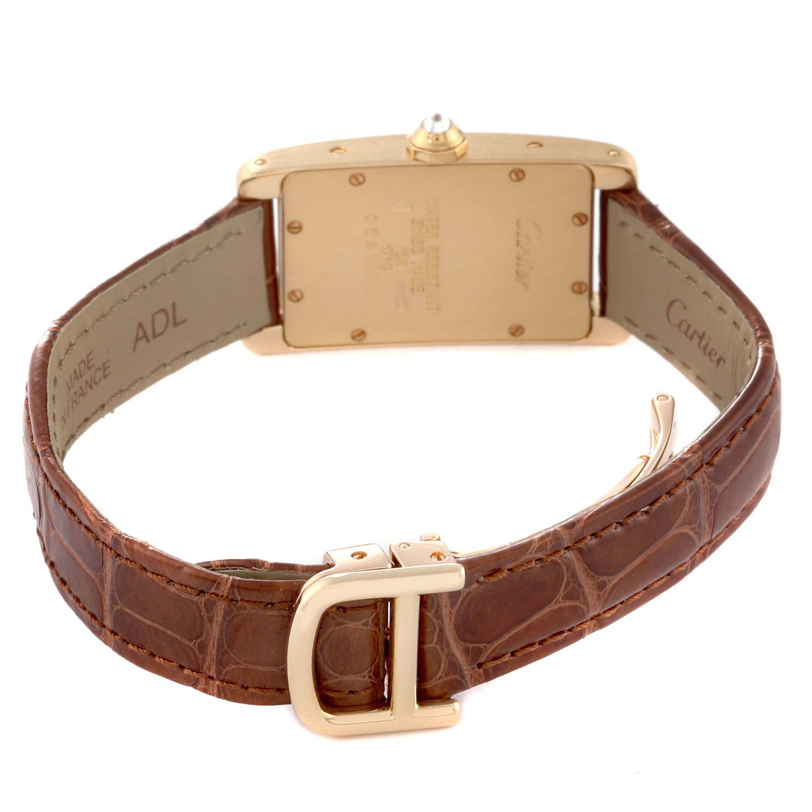 The image shows the Tank Americaine watch by Cartier from the back, including the caseback, leather strap, and buckle.