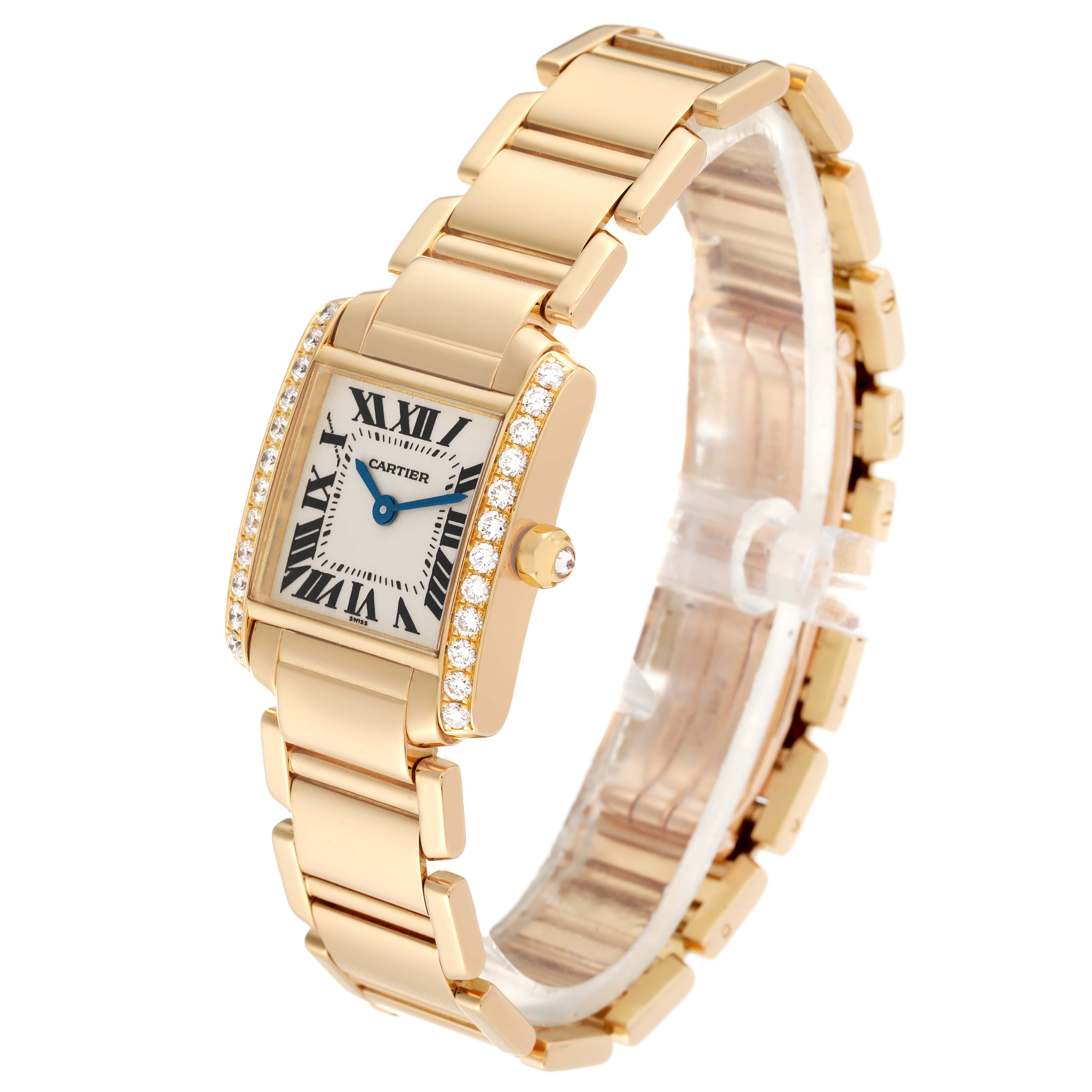 This image shows a Cartier Tank Francaise WE1001R8 Women
s Yellow Gold Silver Dial WE1001R8 Women
s Yellow Gold Silver Dial watch from a front angle, highlighting its rectangular face and gold bracelet.