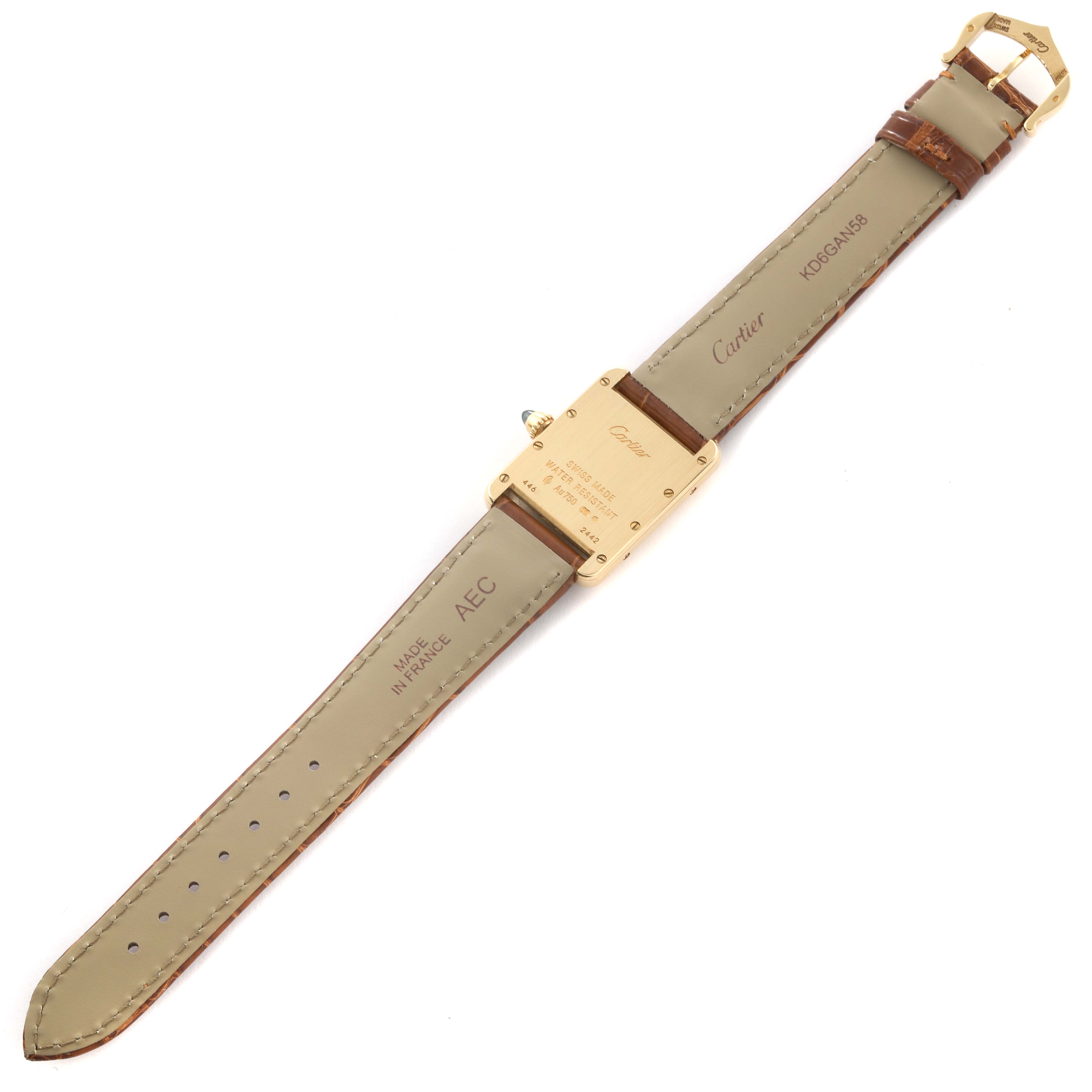 The image shows the back view of a Cartier Tank Louis W1529856 Women's Yellow Gold Silver Dial W1529856 Women's Yellow Gold Silver Dial watch, highlighting the leather strap and the watch case back.