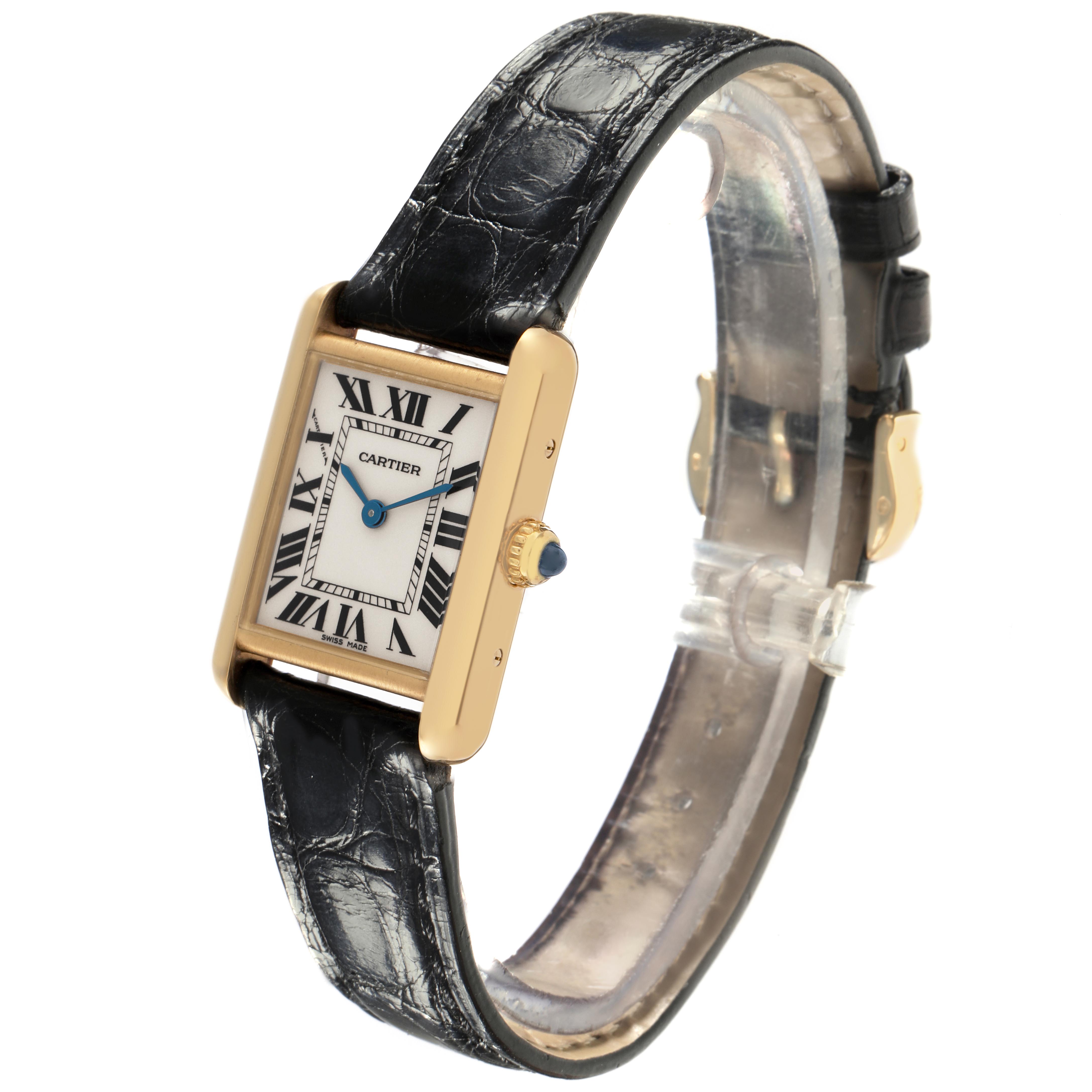 The Cartier Tank Louis W1529856 Women
s Yellow Gold Silver Dial W1529856 Women
s Yellow Gold Silver Dial watch is shown at a three-quarter angle, highlighting the face, crown, and black leather strap.