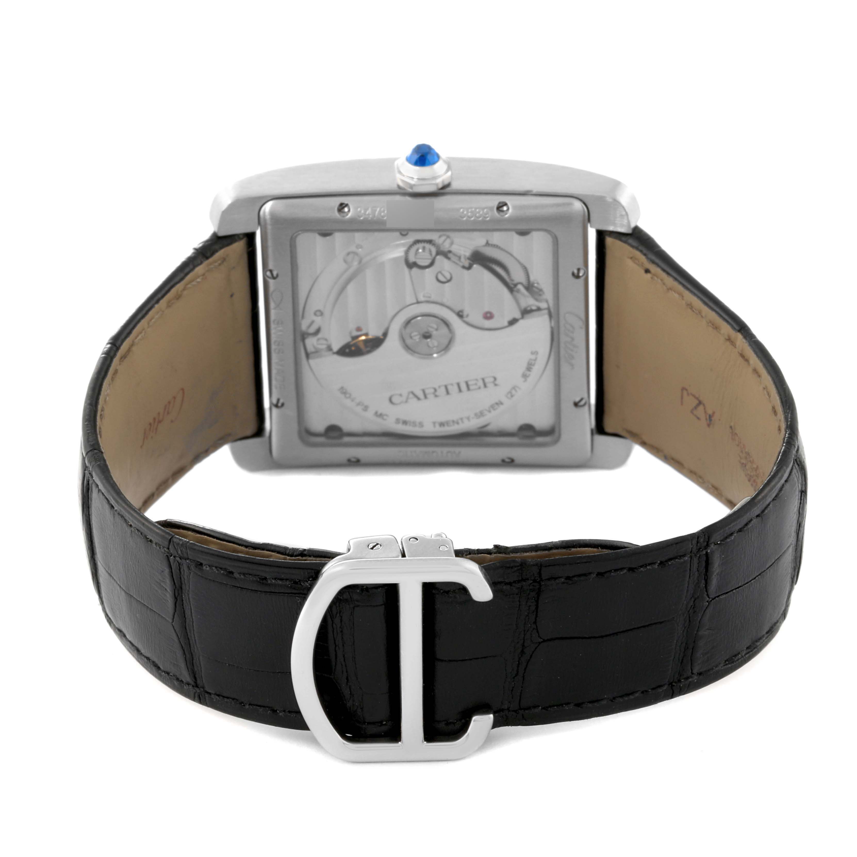 The image shows the back view of a Cartier Tank MC W5330003 Men
s Stainless Steel Silver Dial W5330003 Men
s Stainless Steel Silver Dial watch, highlighting the transparent case back and black leather strap with a clasp.