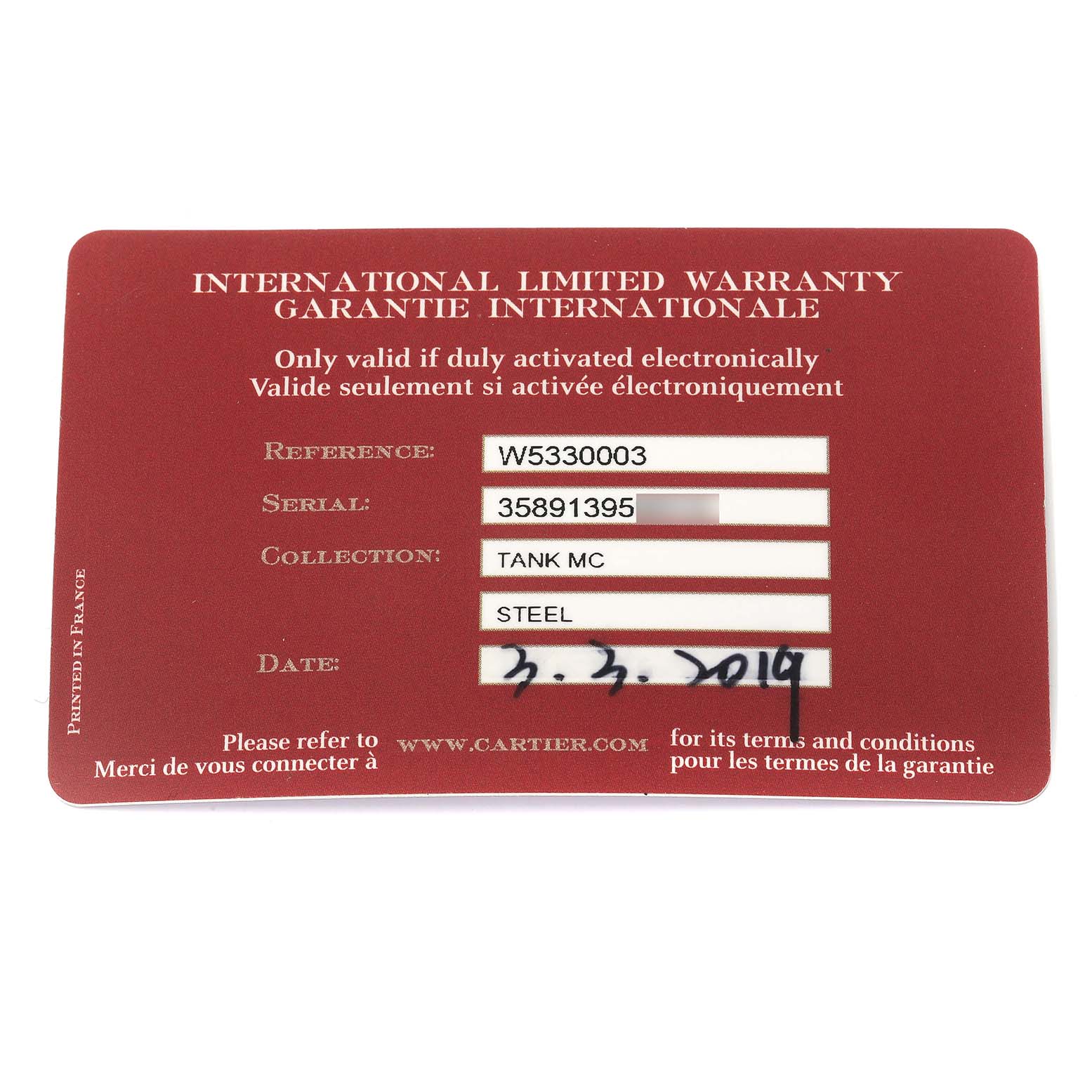 This is an international limited warranty card for the Tank MC model by Cartier, showing reference, serial, collection, and date fields.