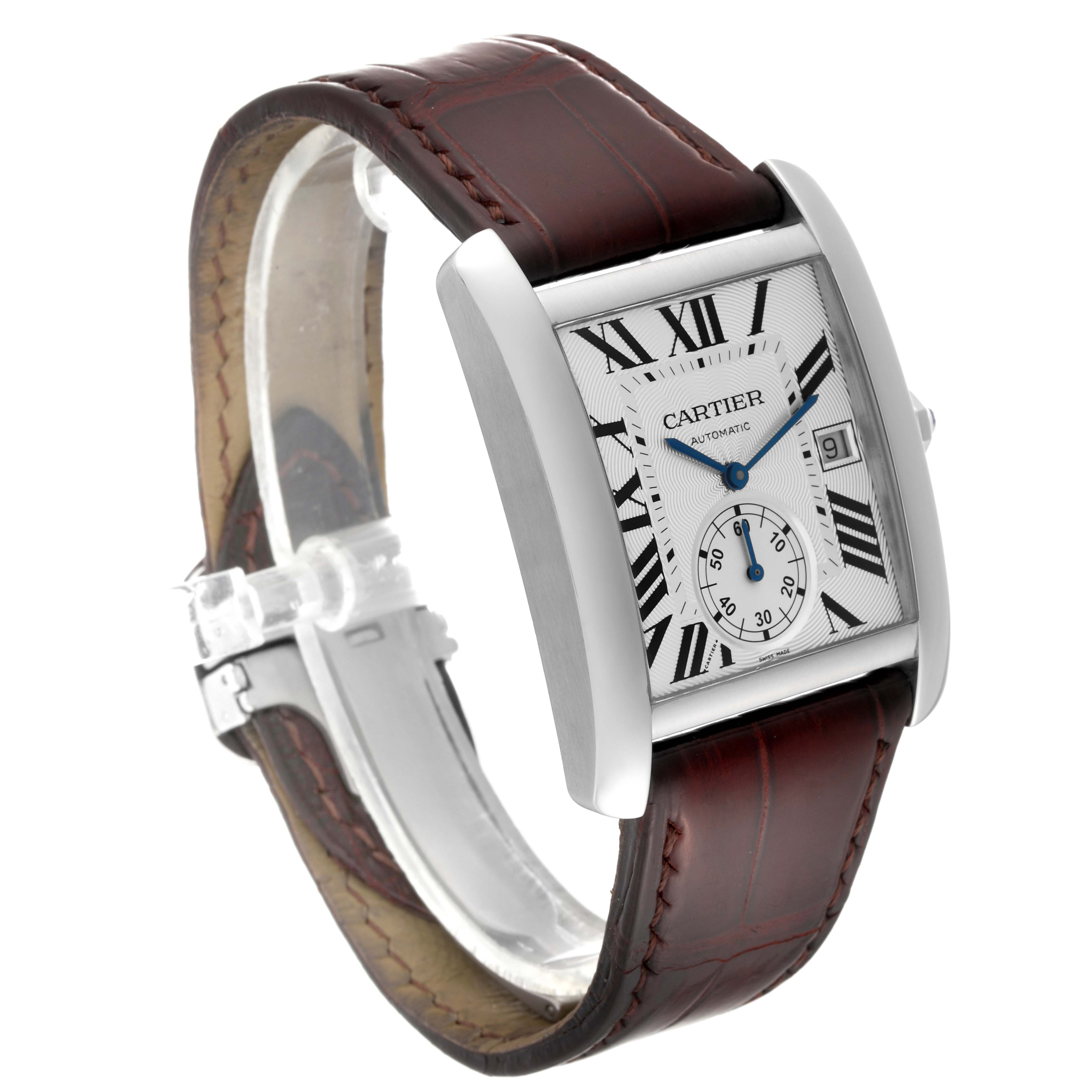 The Tank MC model by Cartier is shown at a slight angle, highlighting its brown leather strap and rectangular face with Roman numerals.