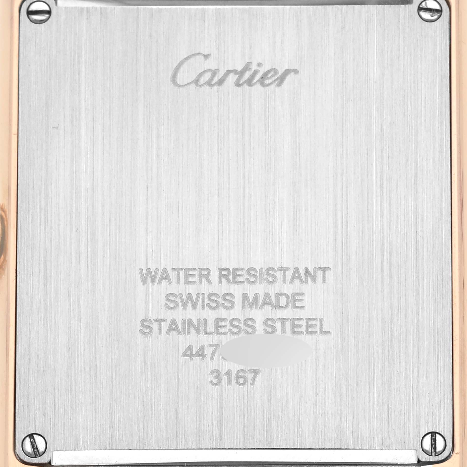 The image displays a rear view of the Cartier Tank Solo W5200025 Men's Rose Gold Silver Dial W5200025 Men's Rose Gold Silver Dial watch, showcasing its engraved stainless steel back.