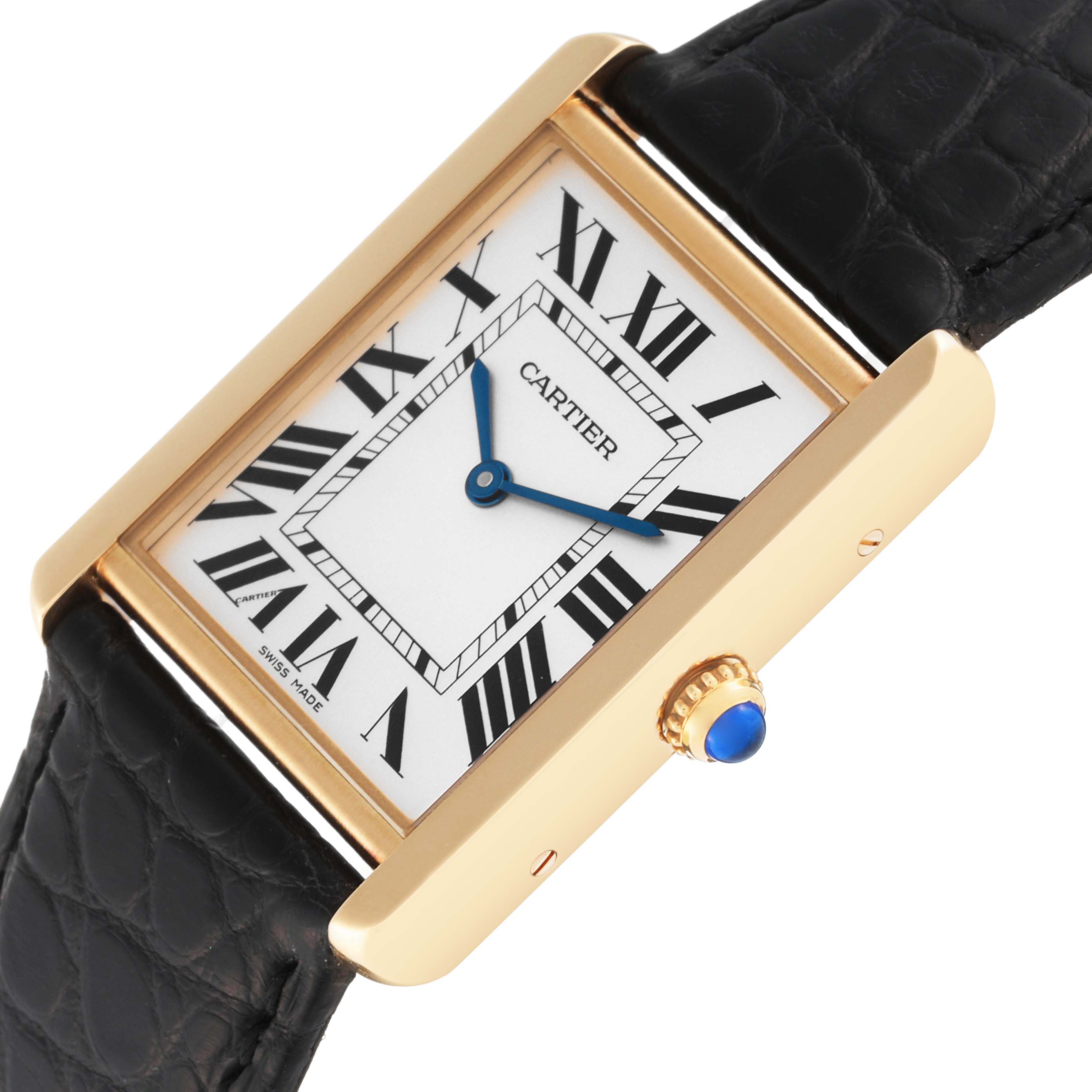 This image shows a close-up of the Cartier Tank Solo W1018855 Men's Yellow Gold Silver Dial W1018855 Men's Yellow Gold Silver Dial watch, highlighting its face, crown, and leather strap at an angled view.