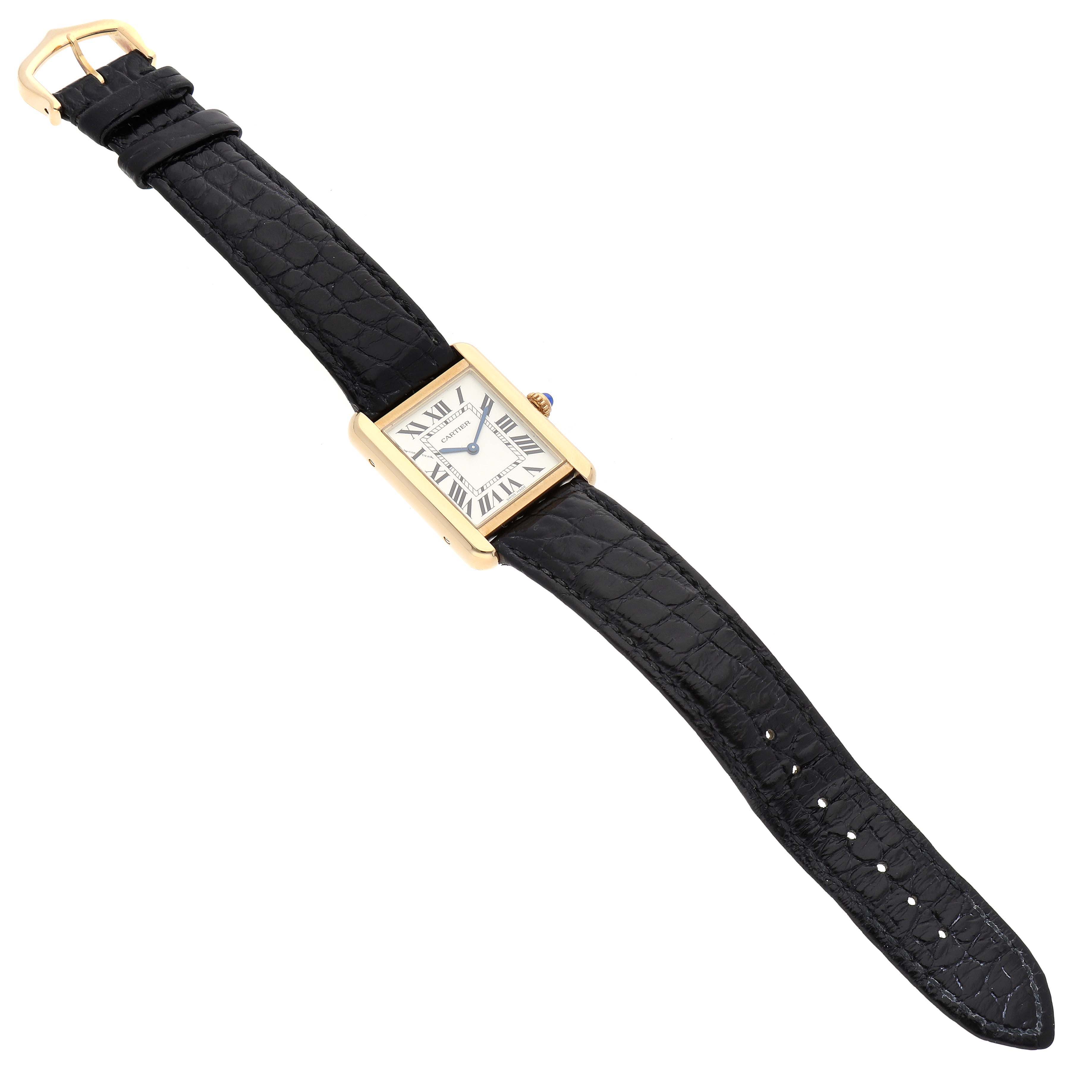The image shows a Cartier Tank Solo W5200002 Women
s Yellow Gold Silver Dial W5200002 Women
s Yellow Gold Silver Dial watch angled diagonally, highlighting the rectangular face, black leather strap, and gold buckle.