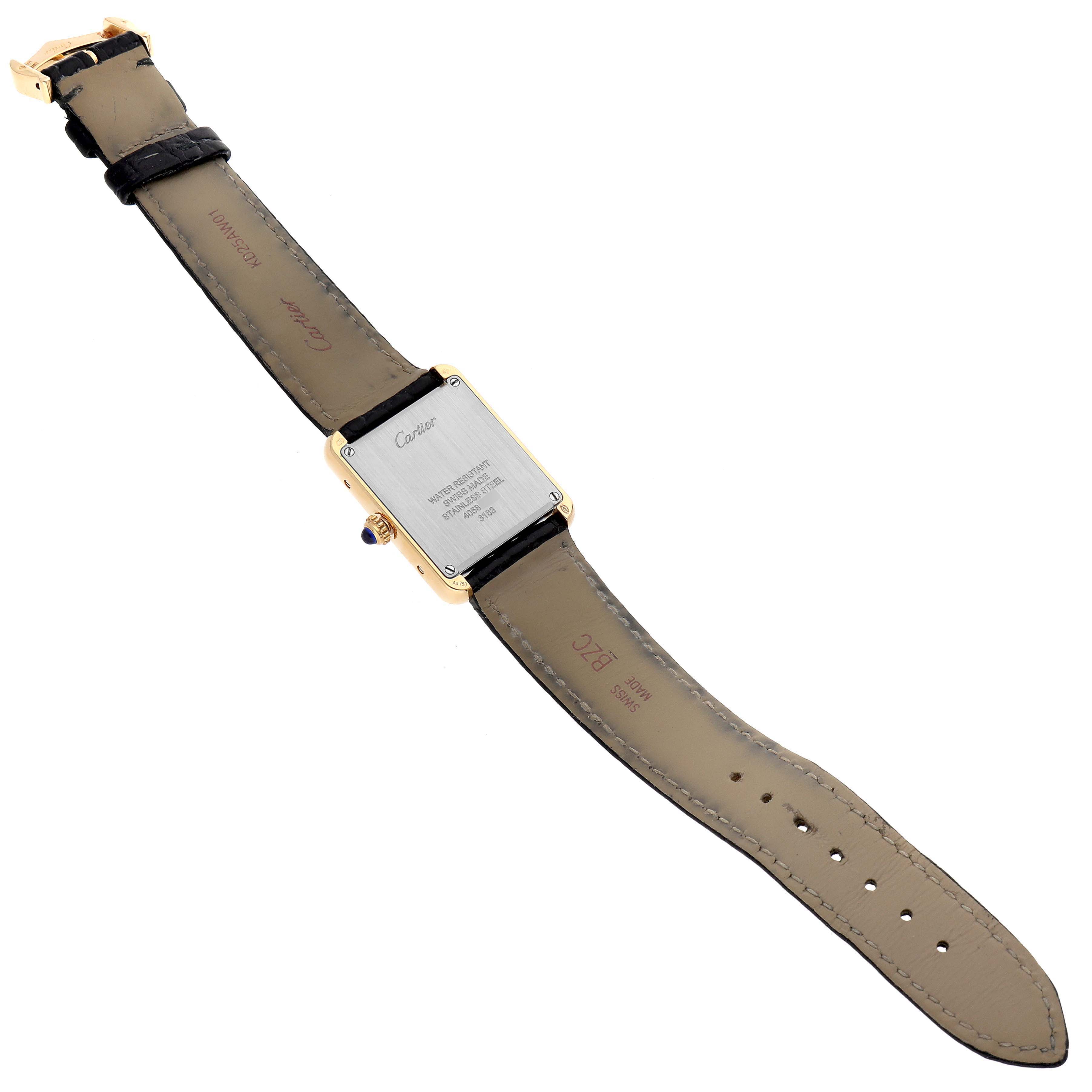 This image shows the back view of the Cartier Tank Solo W5200002 Women
s Yellow Gold Silver Dial W5200002 Women
s Yellow Gold Silver Dial watch, highlighting its leather strap and stainless steel case back.