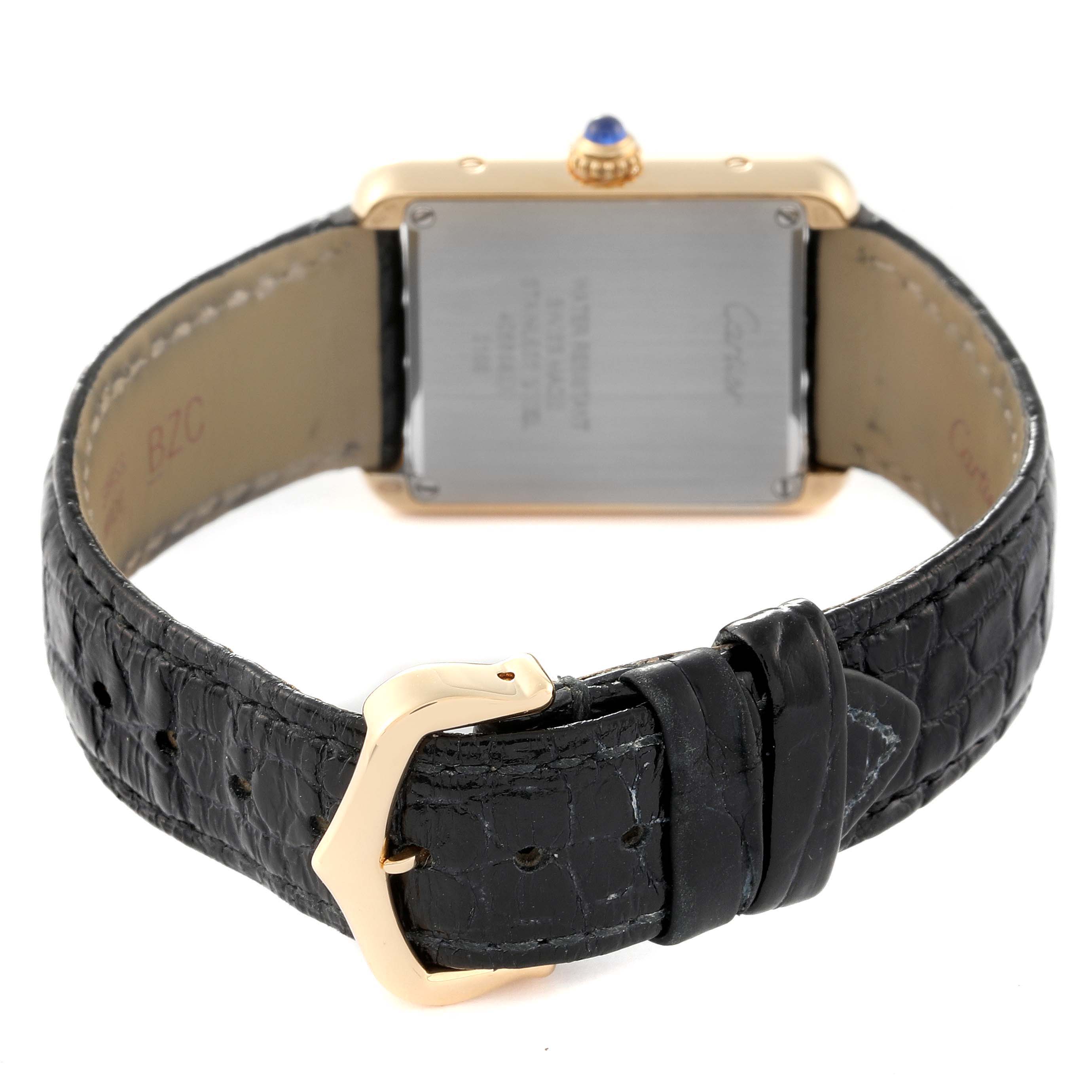 The image shows the back of a Cartier Tank Solo W5200002 Women
s Yellow Gold Silver Dial W5200002 Women
s Yellow Gold Silver Dial watch, highlighting the leather strap and buckle.