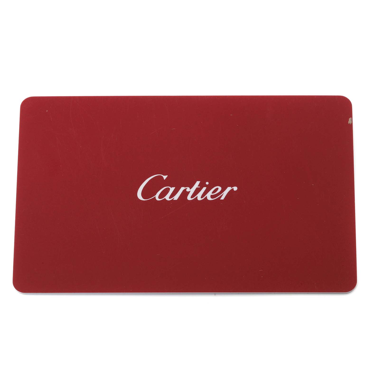 The image displays a red Cartier box, likely for the Tank Solo model watch, with the Cartier brand name on the top.