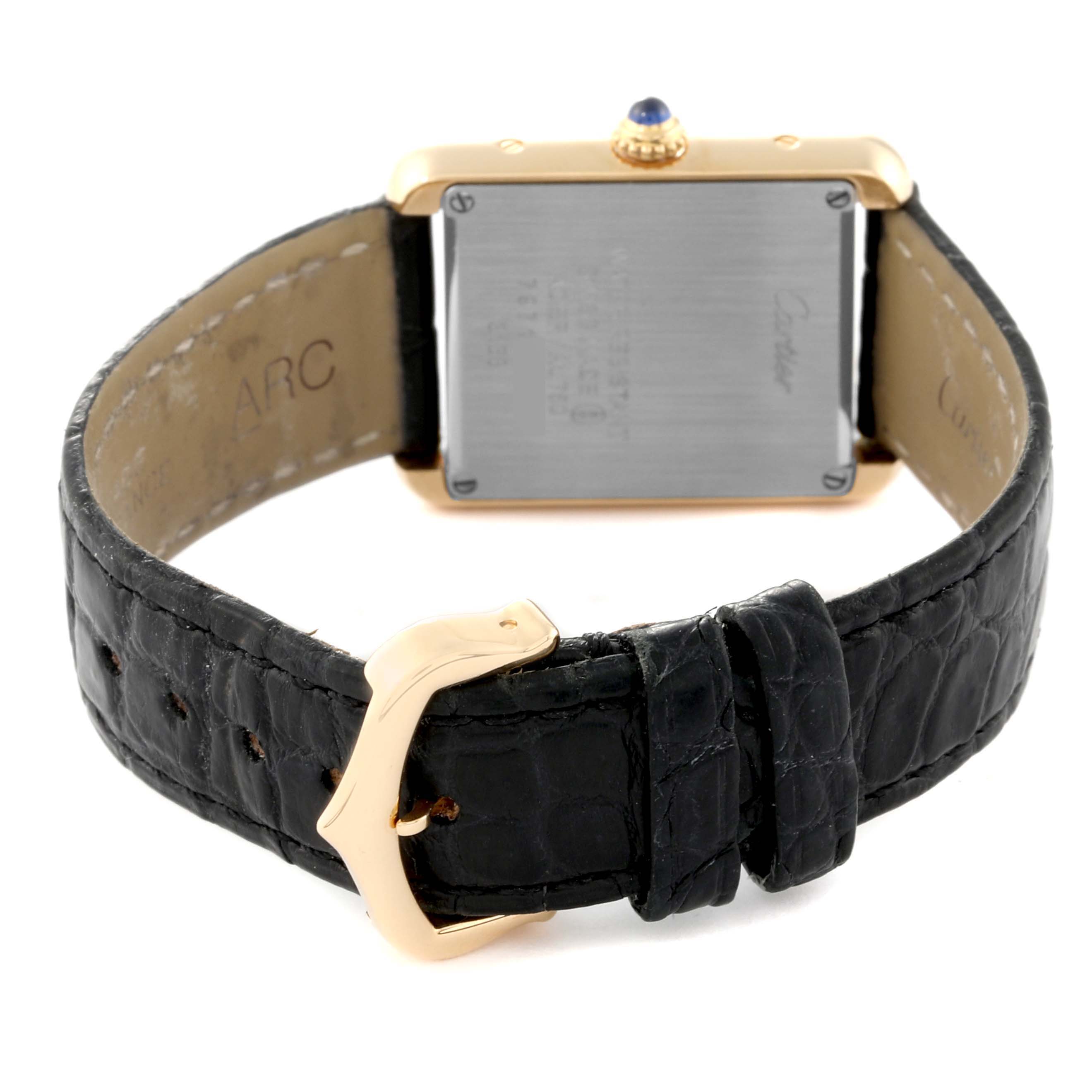 The image shows the back view of the Cartier Tank Solo W5200002 Women's Yellow Gold Silver Dial W5200002 Women's Yellow Gold Silver Dial watch, highlighting its strap, buckle, and case back.