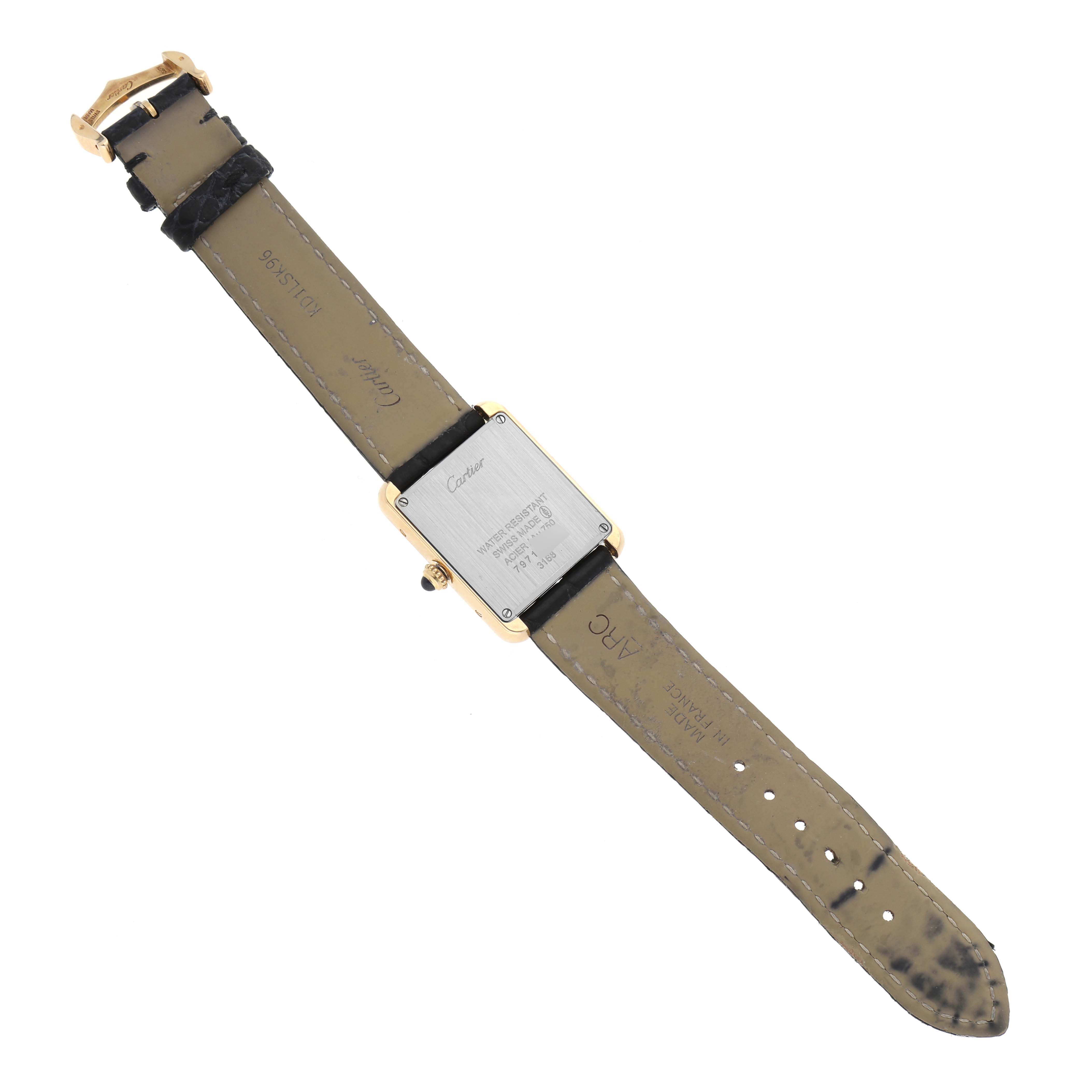 The image shows the back of a Cartier Tank Solo W5200002 Women's Yellow Gold Silver Dial W5200002 Women's Yellow Gold Silver Dial watch, revealing the case back, leather strap, and buckle.