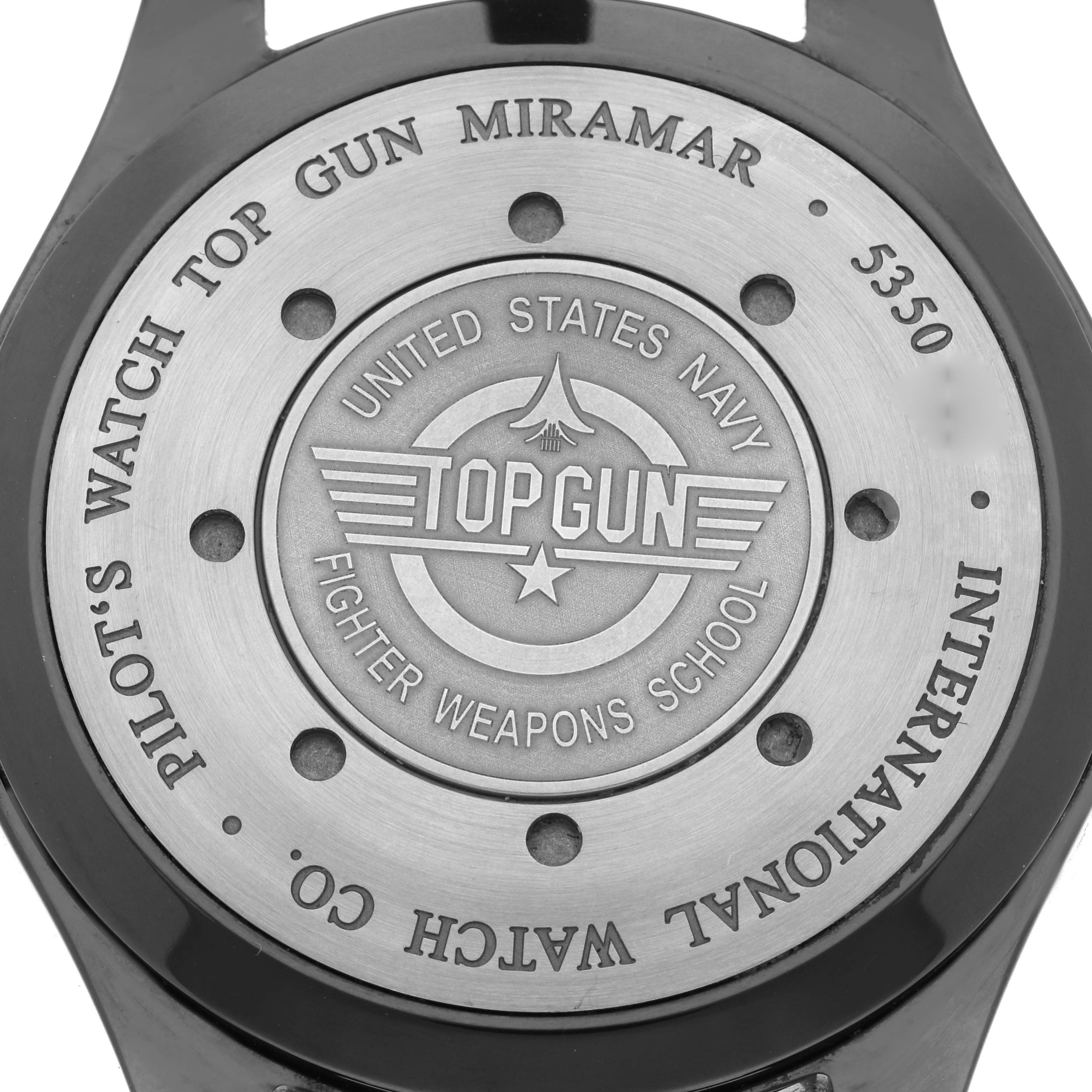 This image shows the back casing of the Pilot Top Gun Miramar watch by IWC, branded with "Top Gun" and other descriptors.